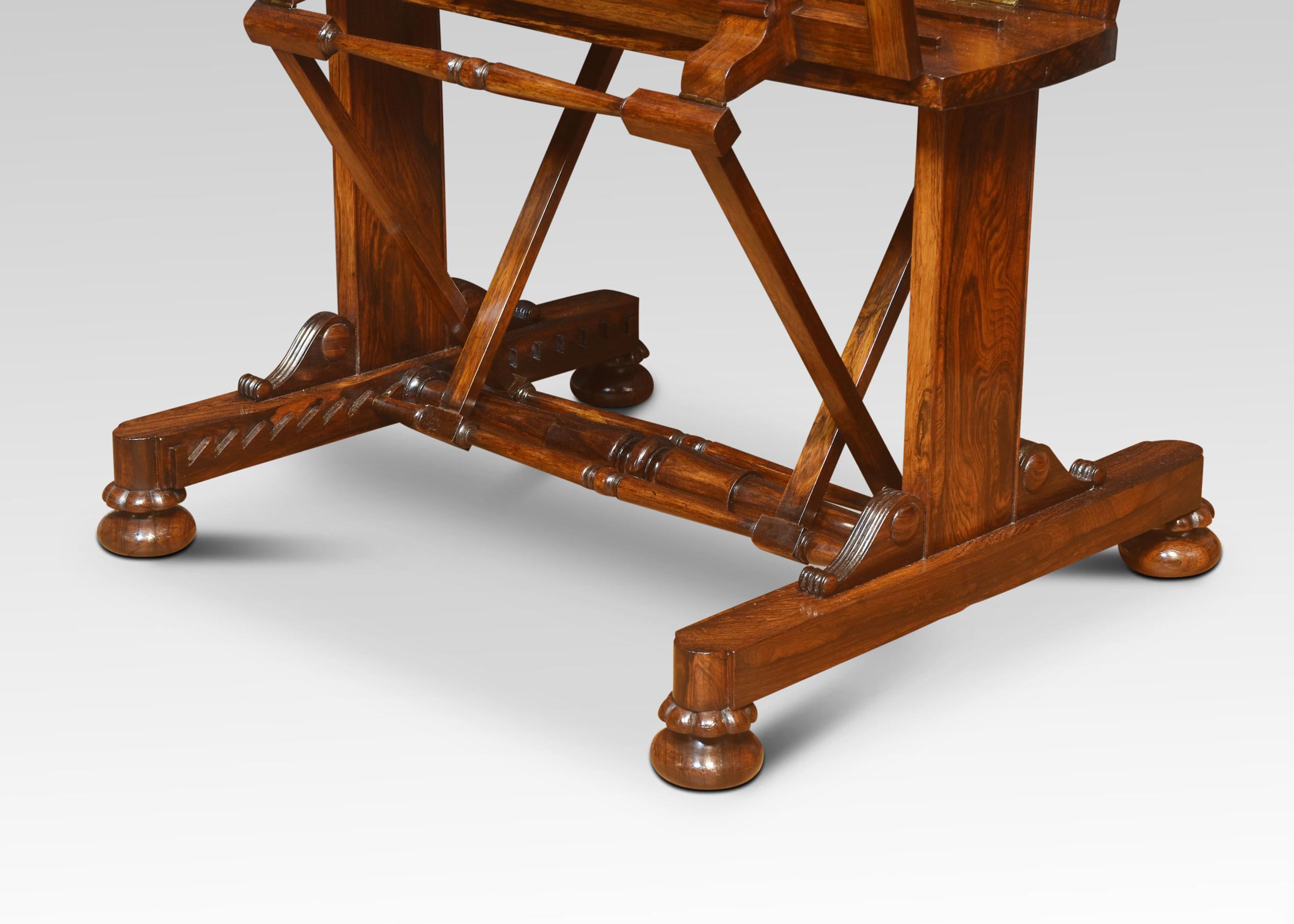 Regency Folio Stand, in the manner of Gillows, with pivoting latticework leaves with turned spindle supports, on standard end supports with sledge bases raised on gadrooned and compressed feet with recessed castors.
Dimensions
Height 40.5