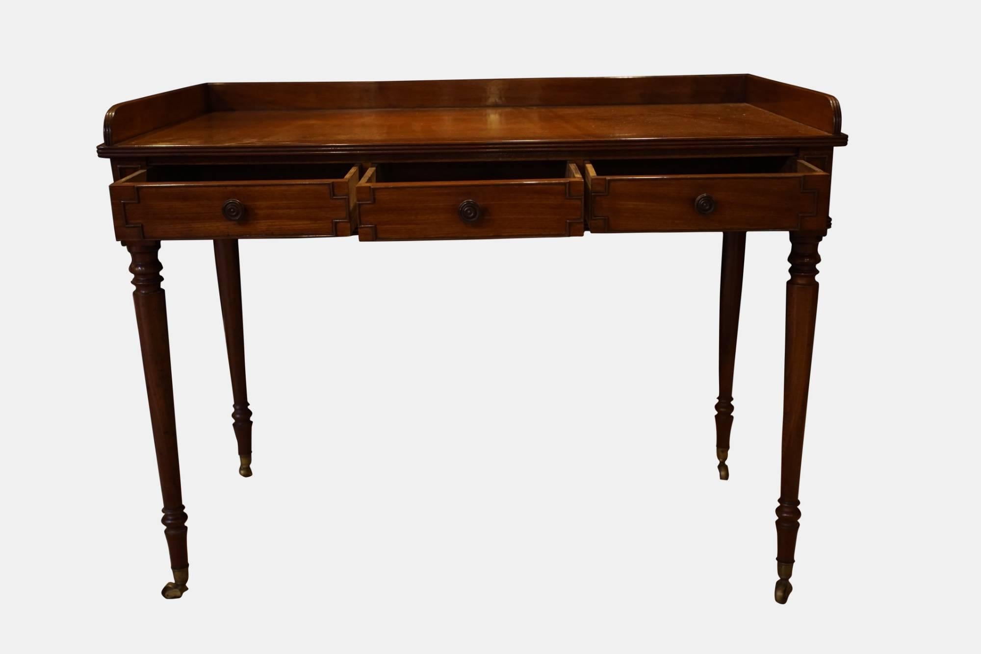 A 3-drawer mahogany side table by Gillow Standing on finely turned legs and ebony knobs,

circa 1820.