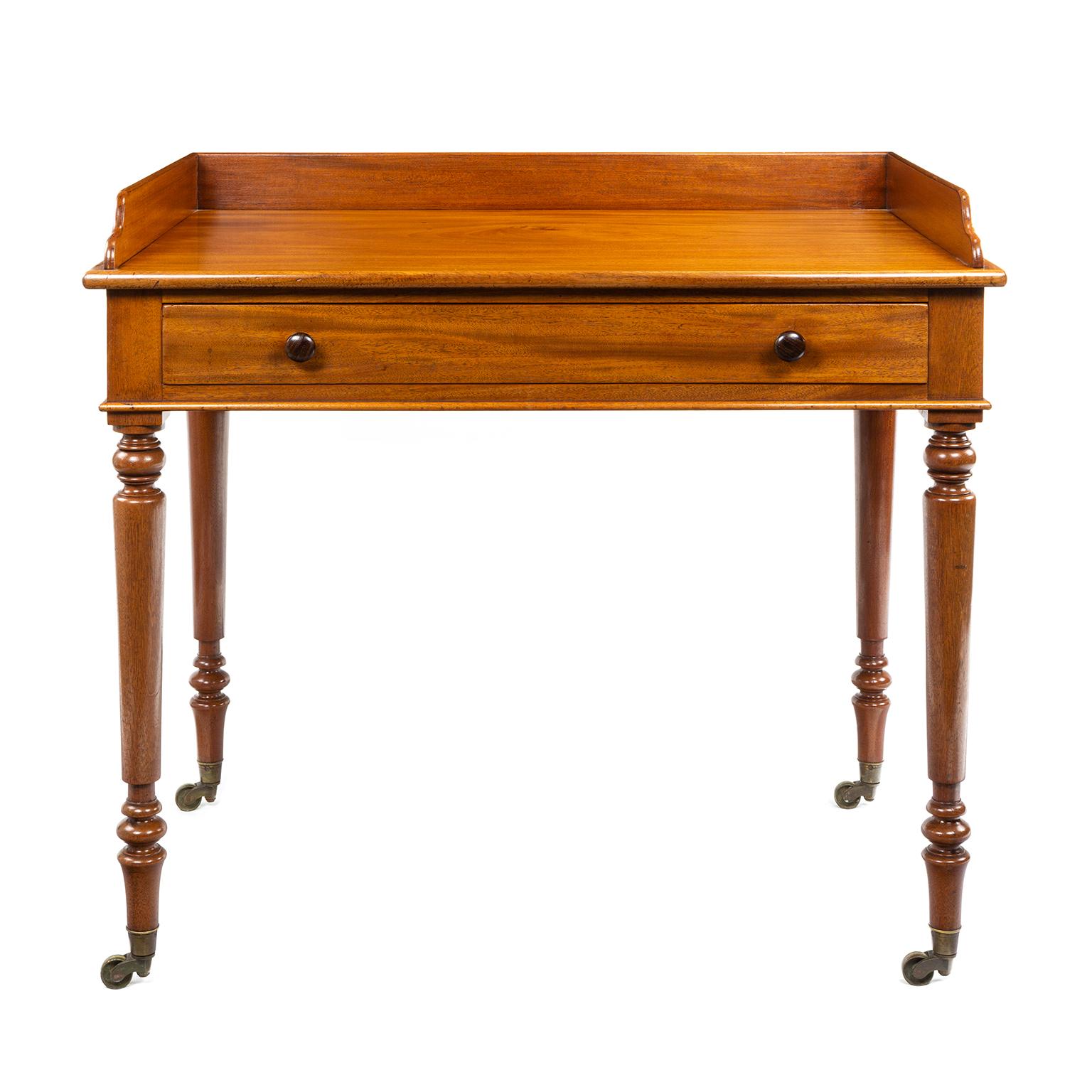A Gillows mahogany wash stand dating to the Regency period, signed by Gillows and also carrying the stamp of a dealer Edwards and Roberts, later they made their own furniture and are well known for highly decorated pieces in the Edwardian