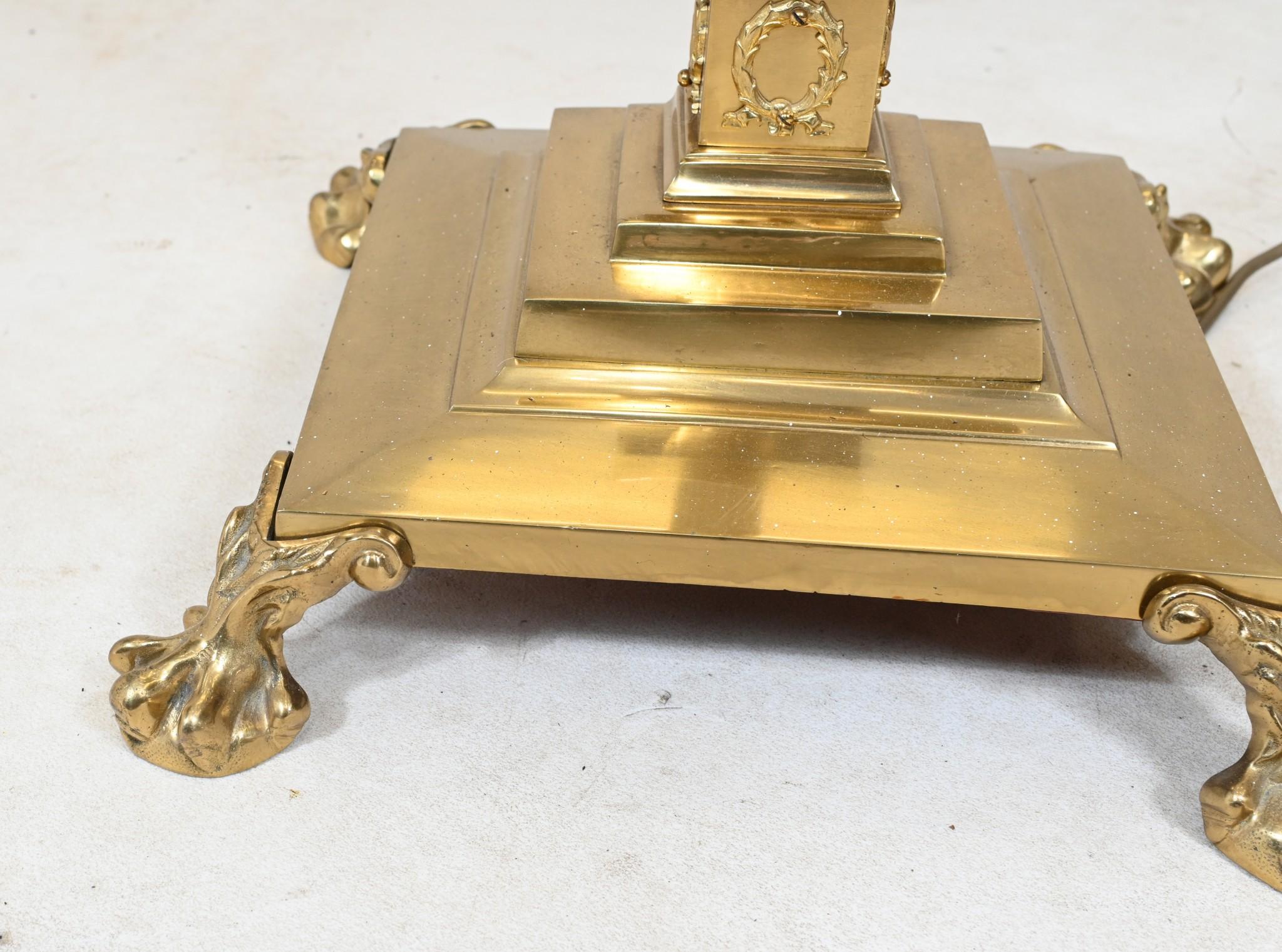 You are viewing a gorgeous Regency manner floor lamp in gilt
Classically fluted Corinthian column for central support
Stands on pedestal base - decorated with a laurel reef motif - and standing on paw feet
Shown with a shade which is not