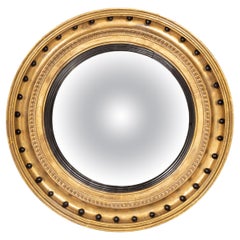 Regency Giltwood and Ebonized Convex Mirror
