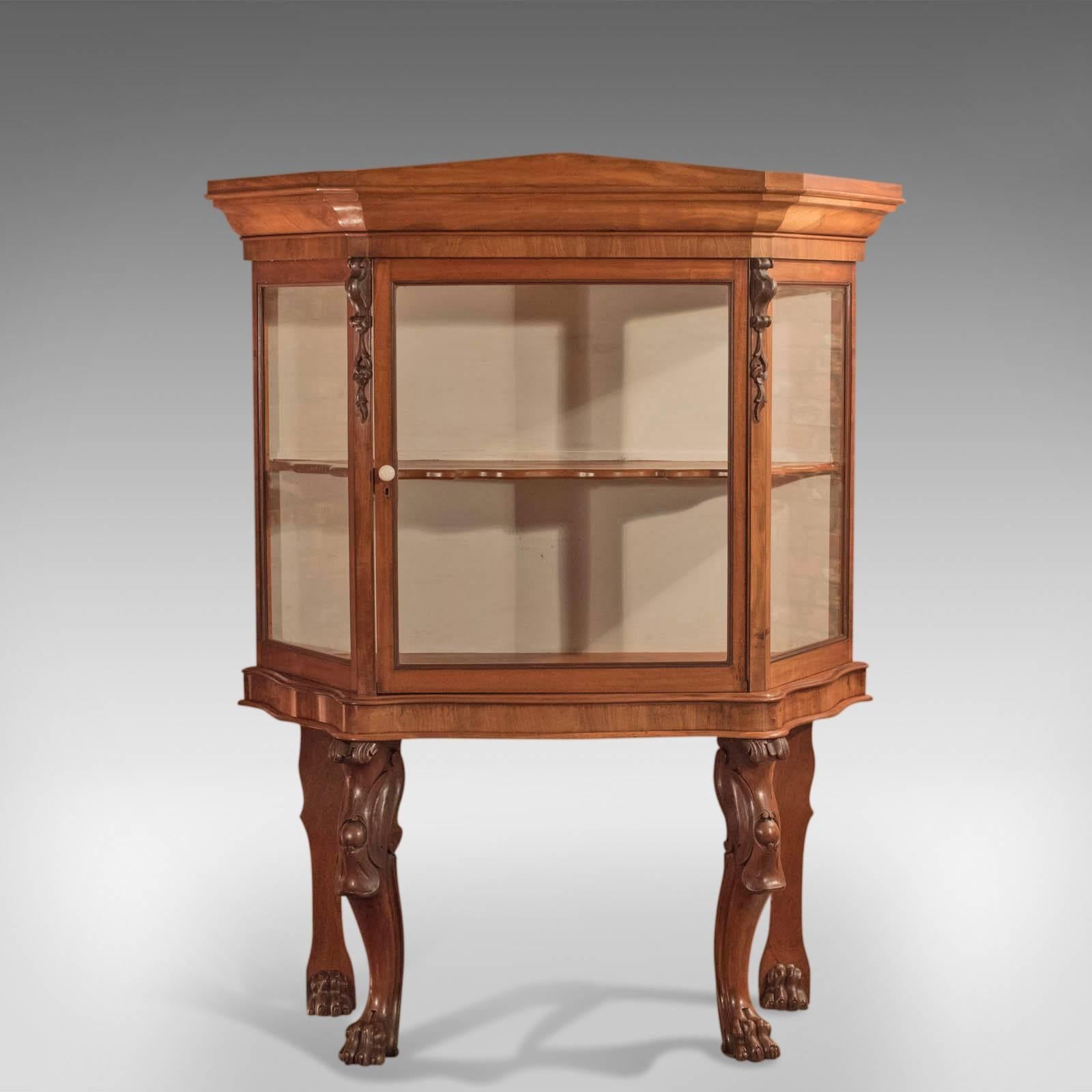 This is an antique, Regency display cabinet in mahogany circa 1820.

Rare, bespoke and of fine quality, this cabinet is raised on the most fabulous cabriole legs to the front; The heavily carved knees display scroll and foliate detail and sweep