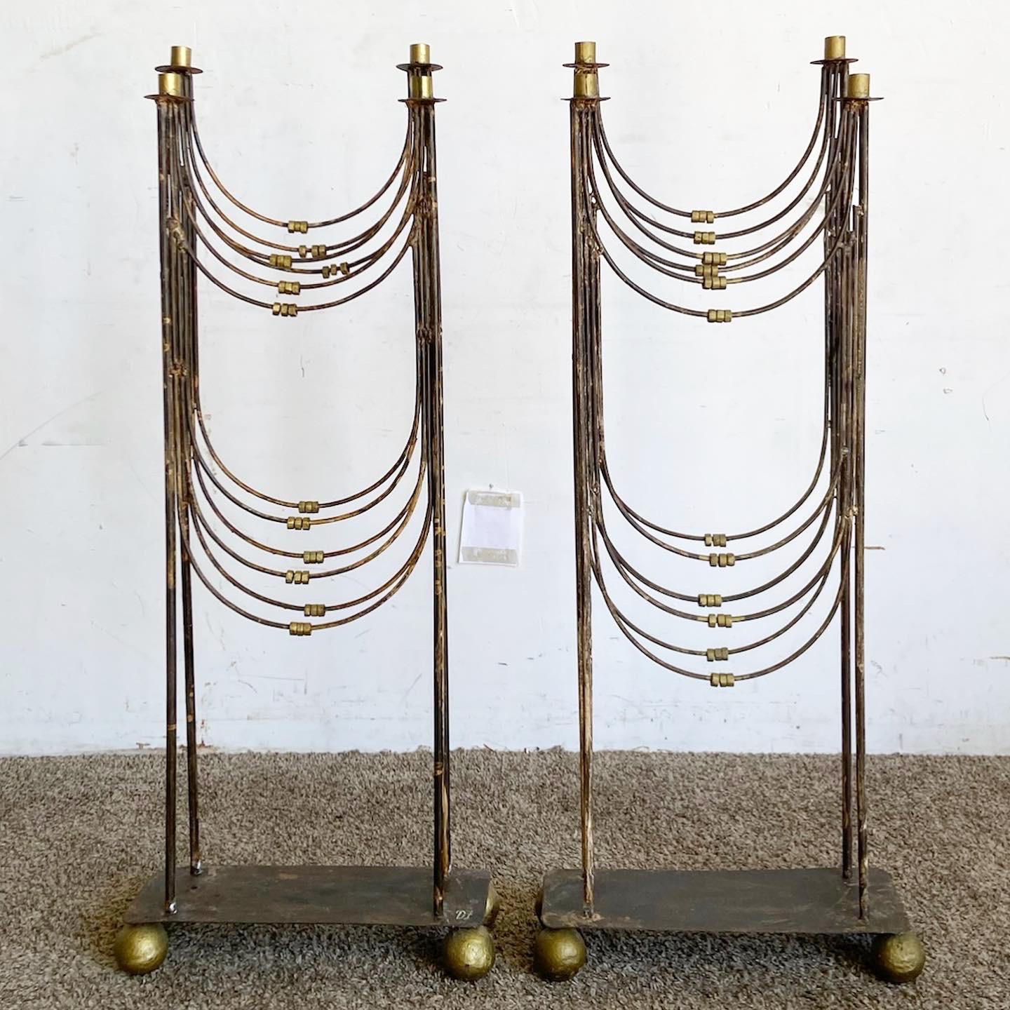 Elevate your space with the Gold and Silver Floor Candelabras. This Regency-style pair combines gold and silver metals, offering a luxurious touch. With four arms each, they are both functional and decorative, perfect for adding timeless opulence to