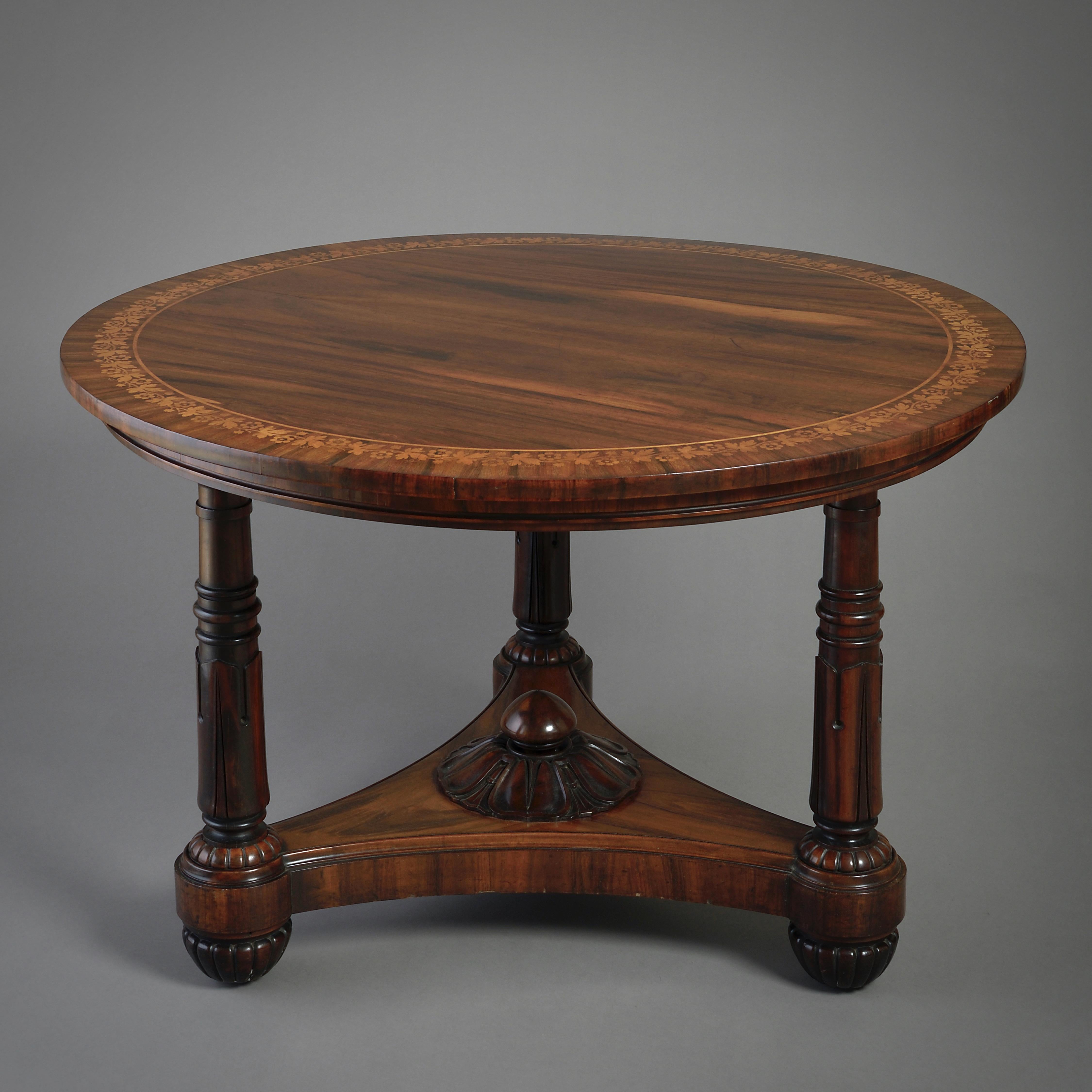 A fine regency Goncalo Alves centre table in the manner of George bullock, circa 1820.

Inlaid in holly with a band of leaves and flowers.