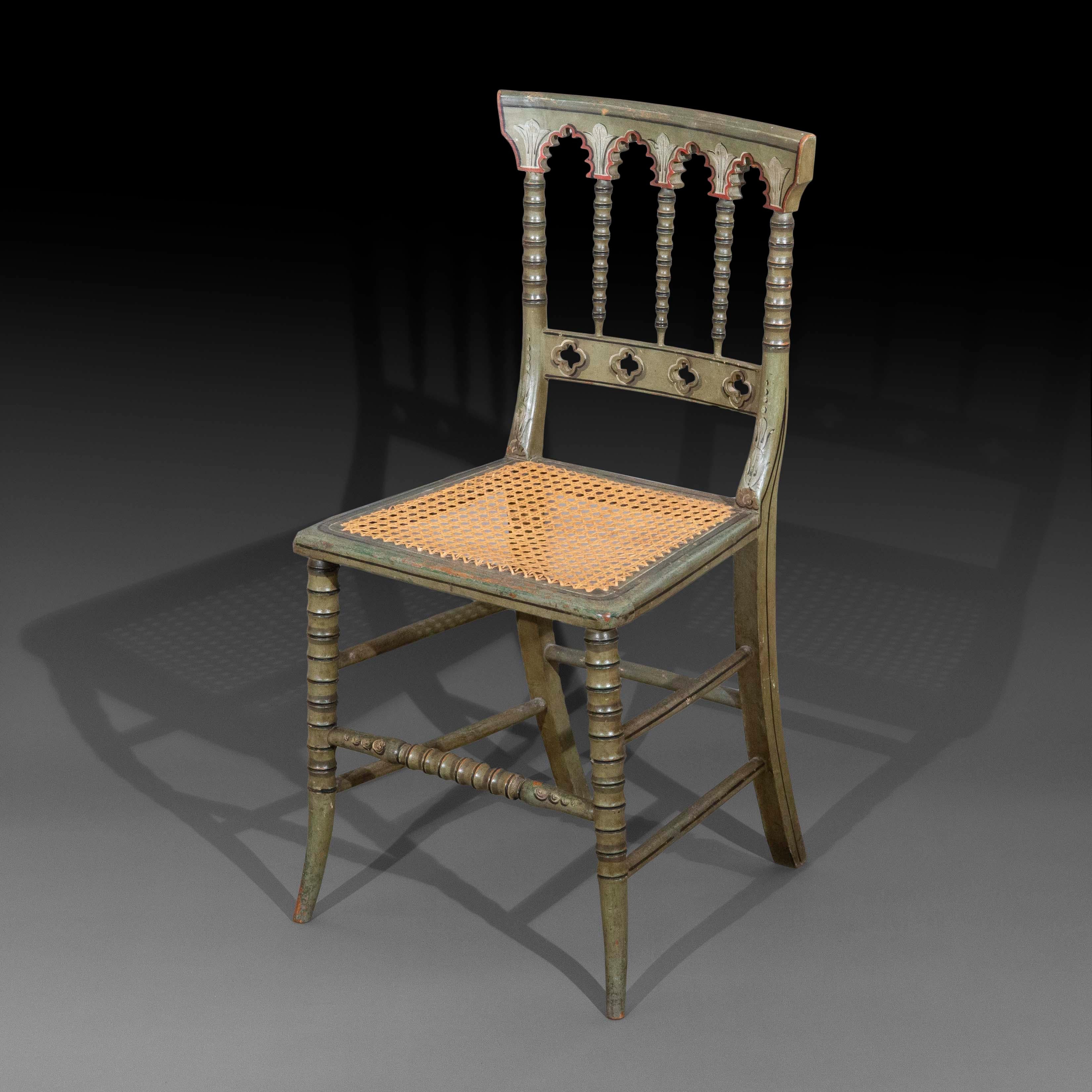 A charming and rare chair of the late Regency era, pale-green and polychrome painted in the Gothic fashion. England, circa 1825.

Why we like it
We like the unusual delicacy and lightness of this chair, and the age-softened look of its charming,