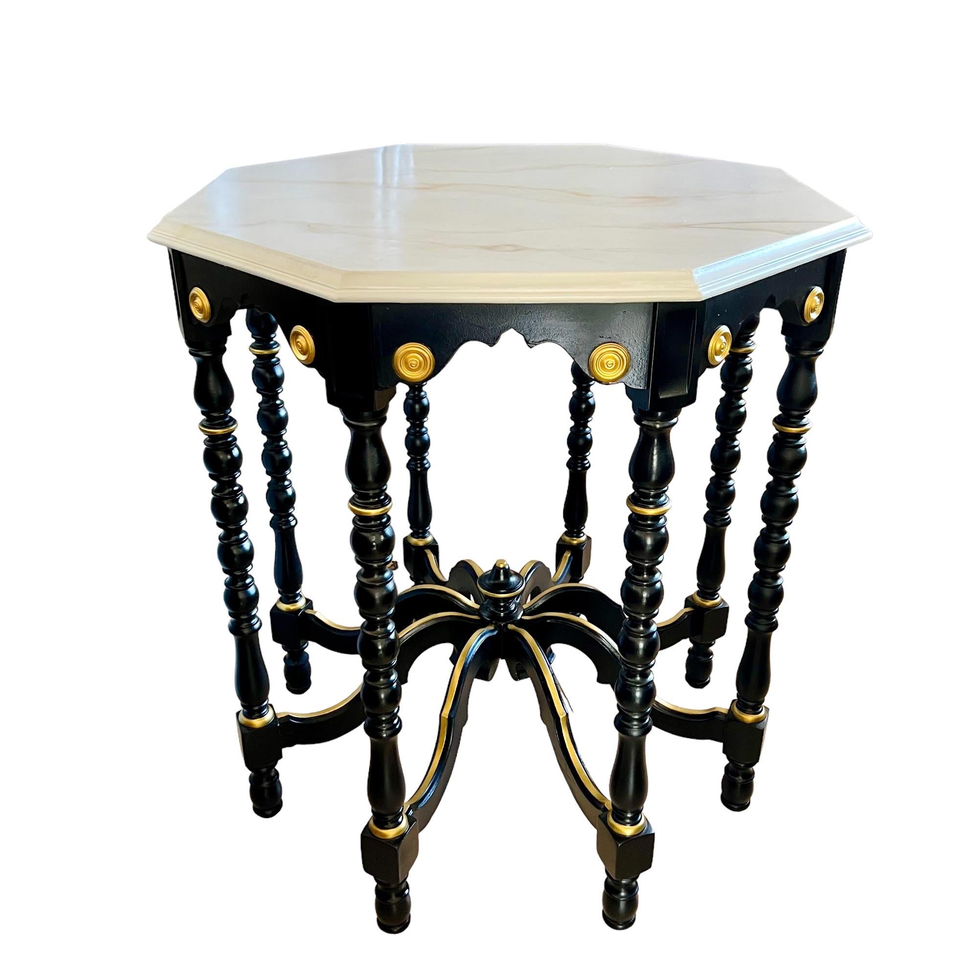 This vintage Eastlake mahogany octagonal eight leg accent table has been given a custom Regency style update featuring a hand painted faux Carrara marble beveled top in pearlescent white/cream with veins & undertones in shades of beige, gold,