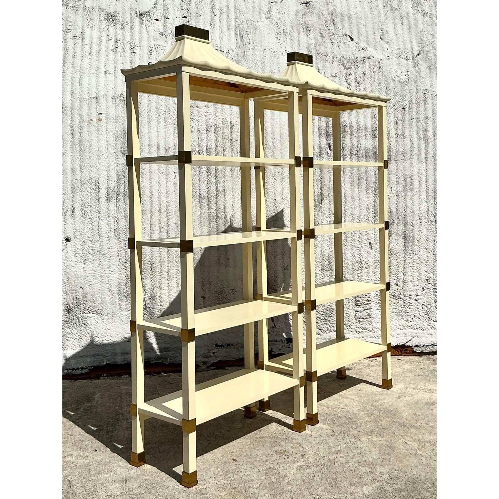 Elevate your interior with this exquisite pair of vintage Henredon lacquered pagoda étagères, a striking example of Hollywood Regency flair blended with timeless Asian-inspired design. Topped with elegant pagoda-style crowns and finished in a creamy