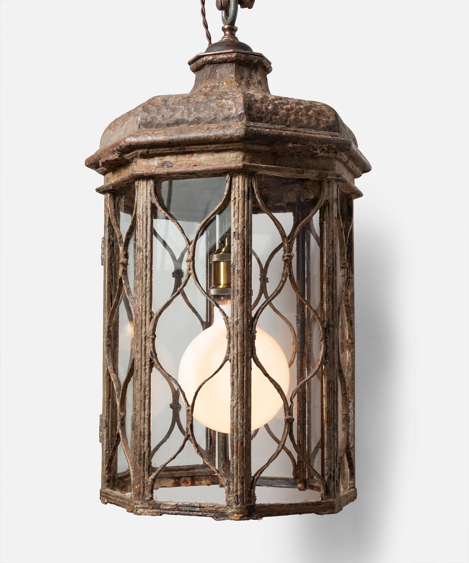 Regency iron lantern, England, circa 1815.

Octagonal form with iron work panels and clear glazing.