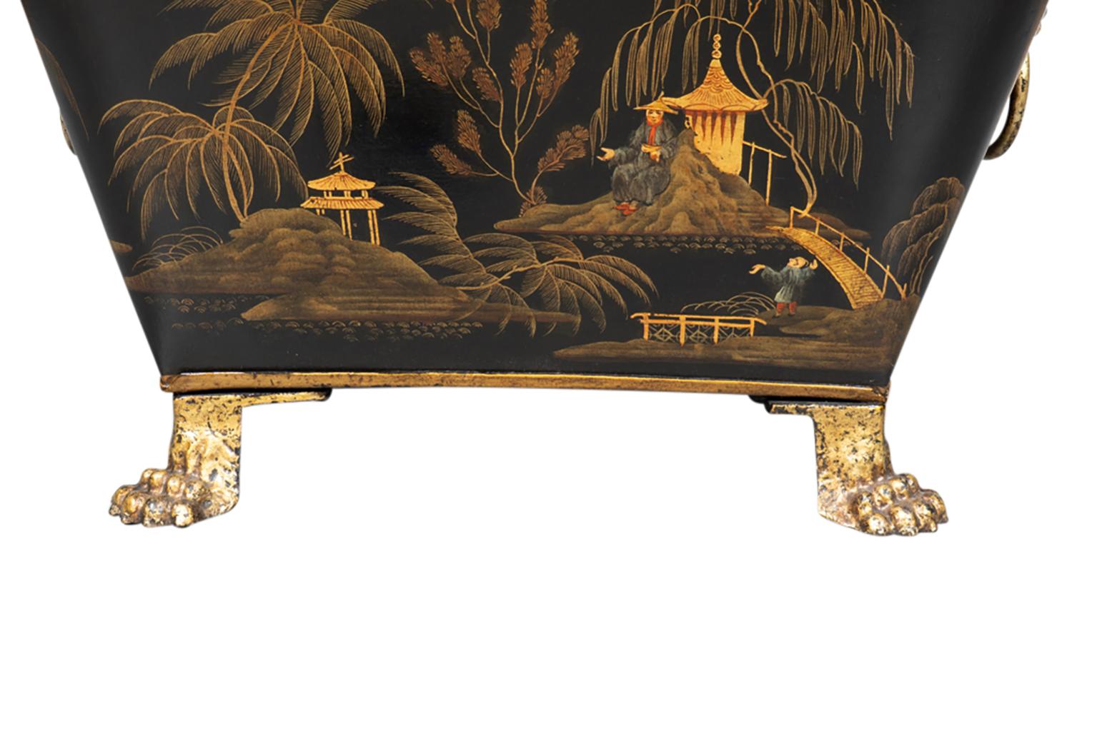 With a domed lid with handle and conforming bin with claw feet.