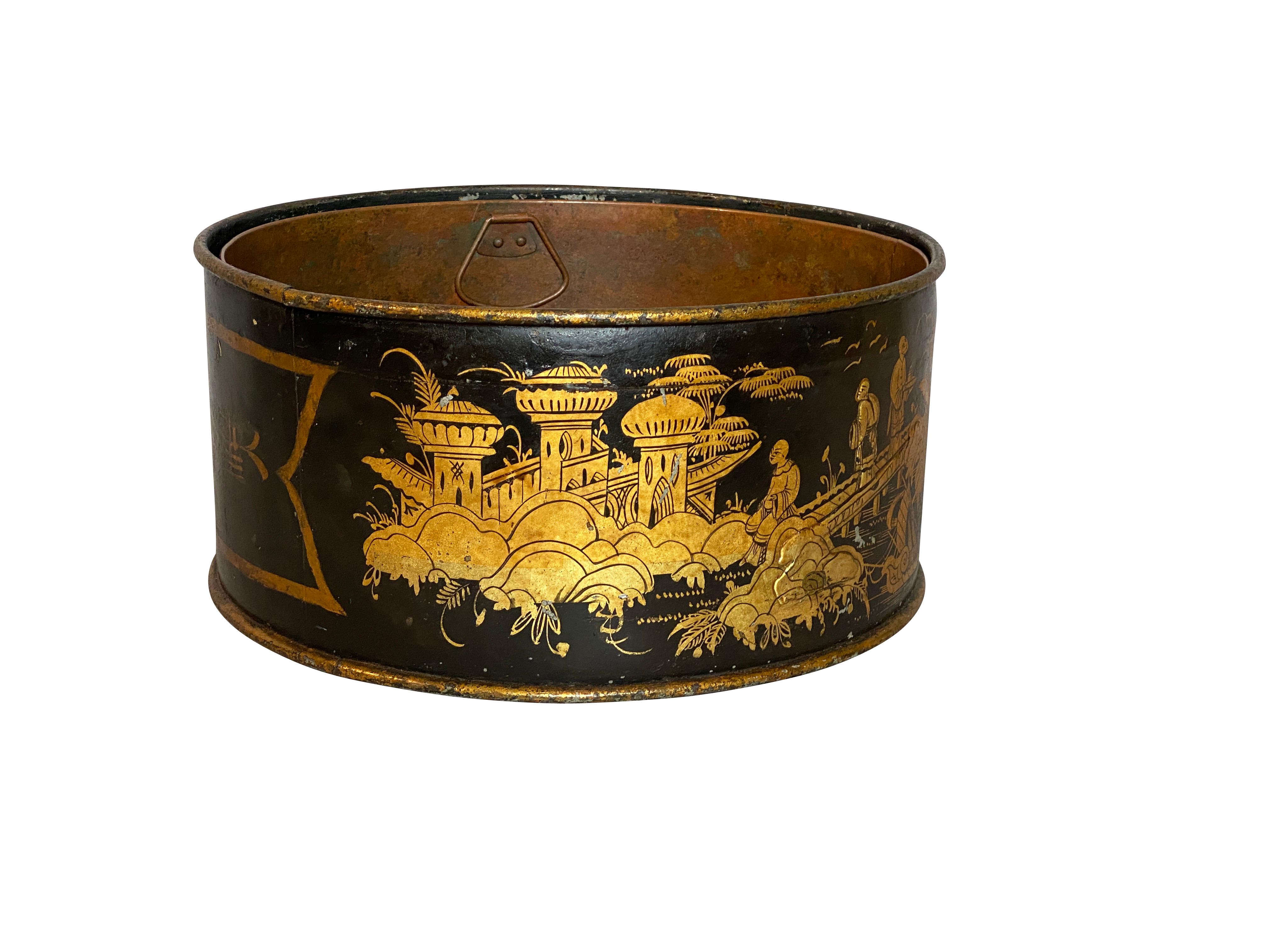 Circular with copper liner. Finely and beautifully decorated with Asian inspired gilded pavilions and landscapes in subtle colors and fine patina.