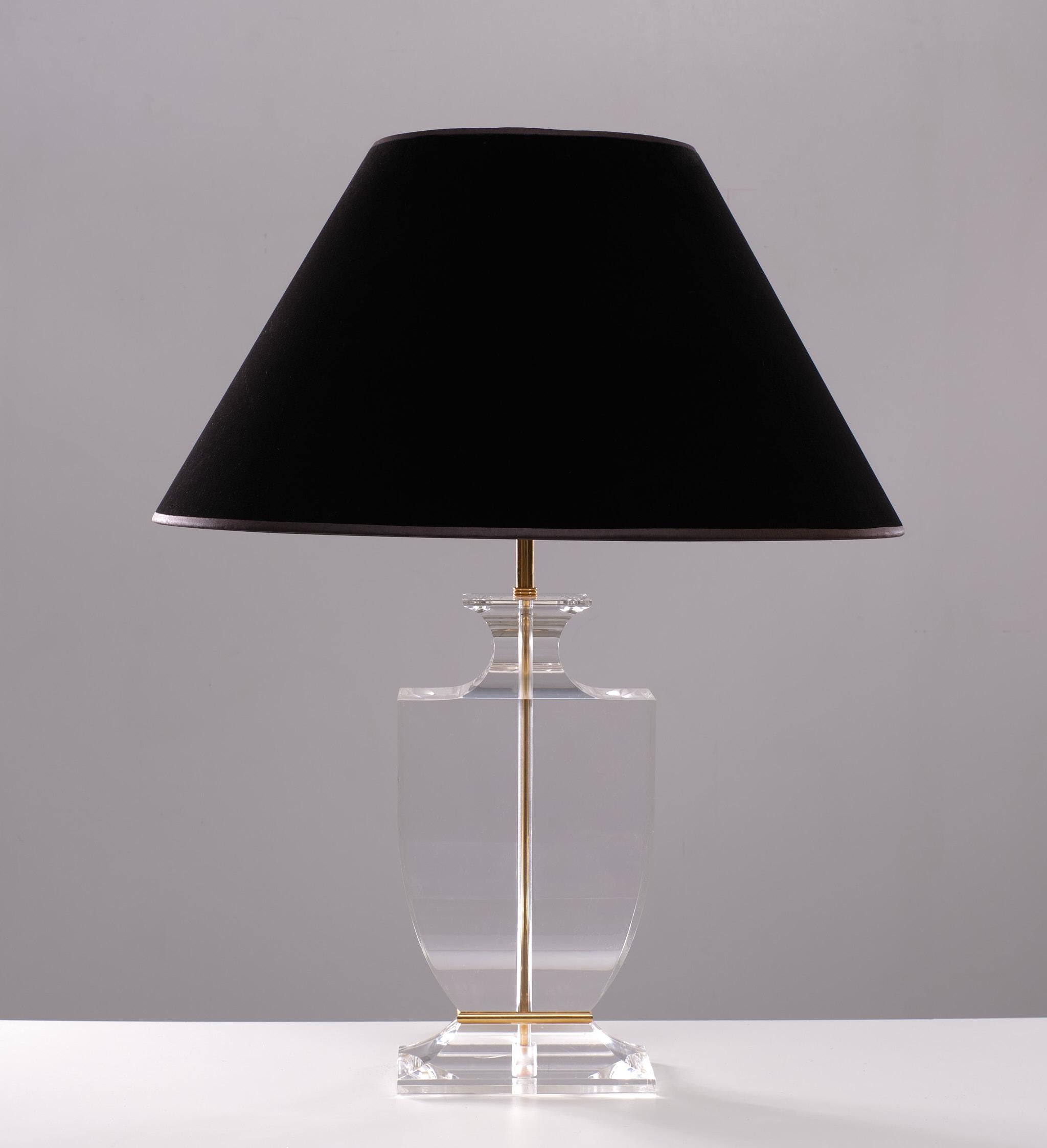 Superb table lamp. Thick top quality Lucite, comes with Gold plated details. 
Complete with a black Velvet shade. One large E27 bulb needed.
Hollywood Regency style. France, 1970s.