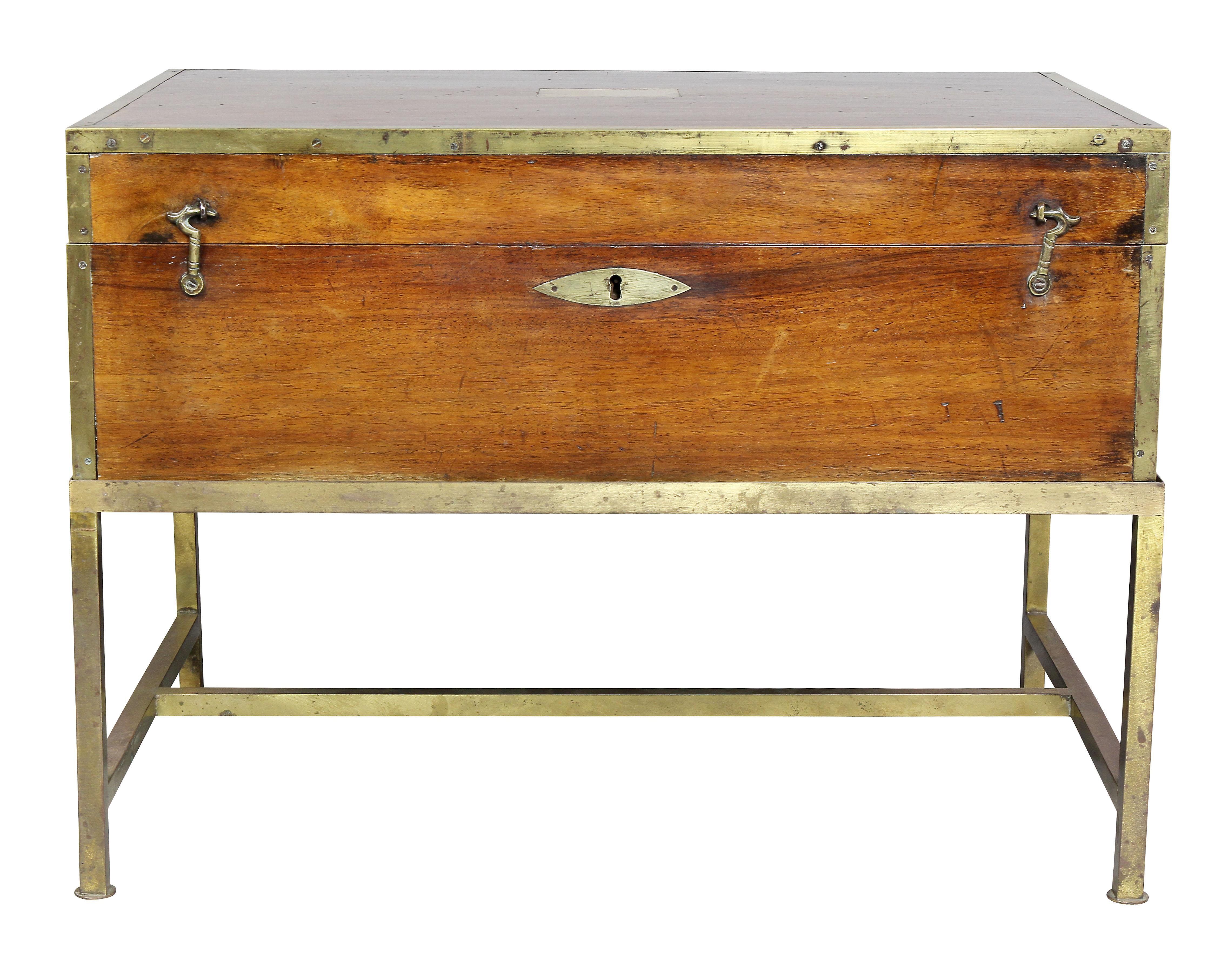 Rectangular hinged top with simple rectangular plaque and brass bound edge, conforming case section, later brass base.