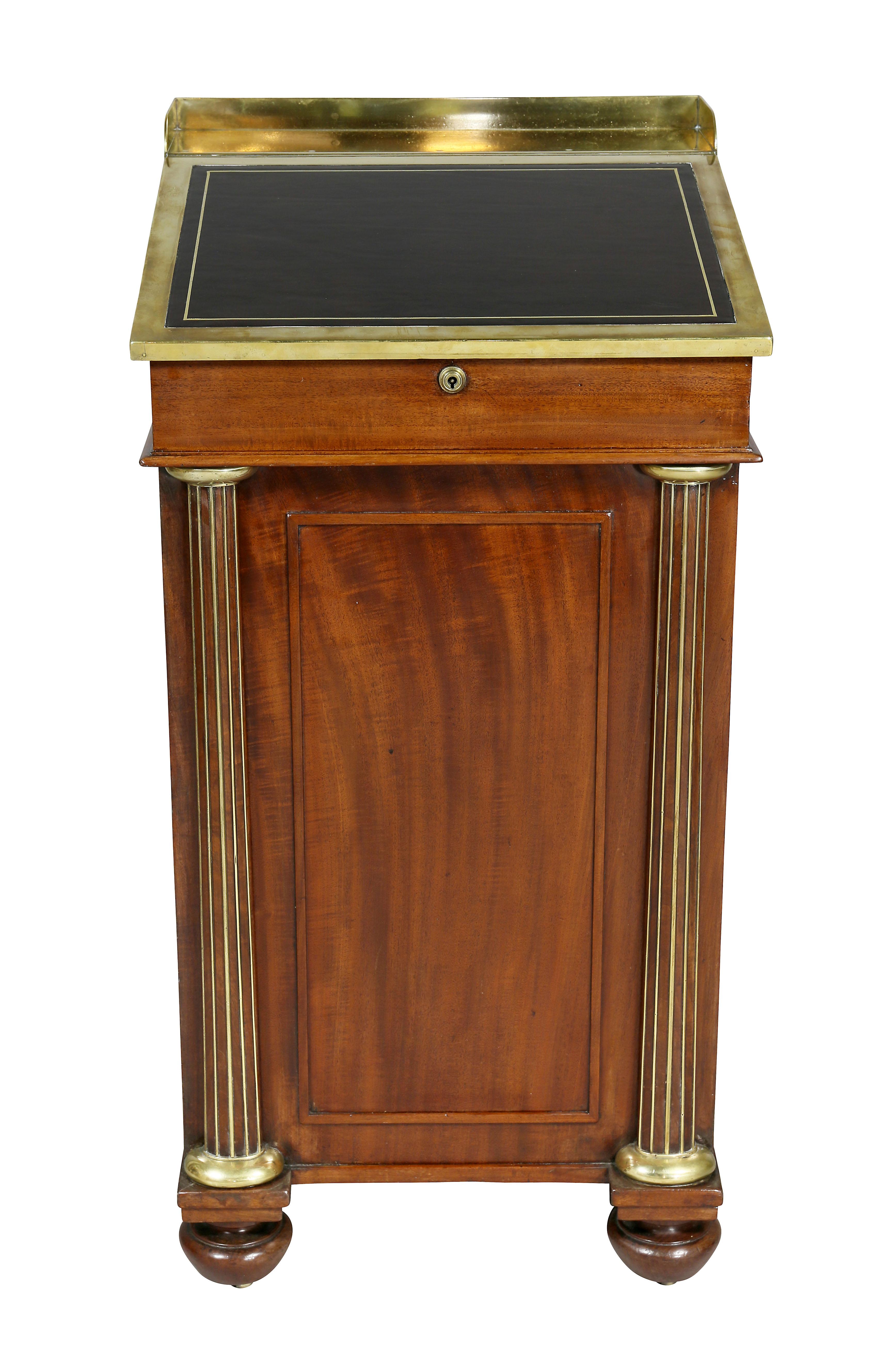 With a slant lid adjustable hinged leather writing surface with interior, over real and opposing false drawers and brass-mounted columns ending on bun feet. Keys. Provenance; Apter- Fredericks, London.