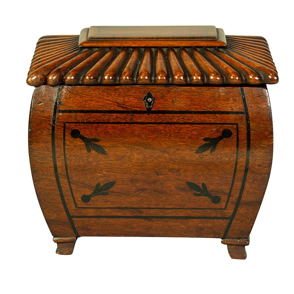 With reeded pagoda hinged top over a bombe case with ebony inlays. Bracket feet.