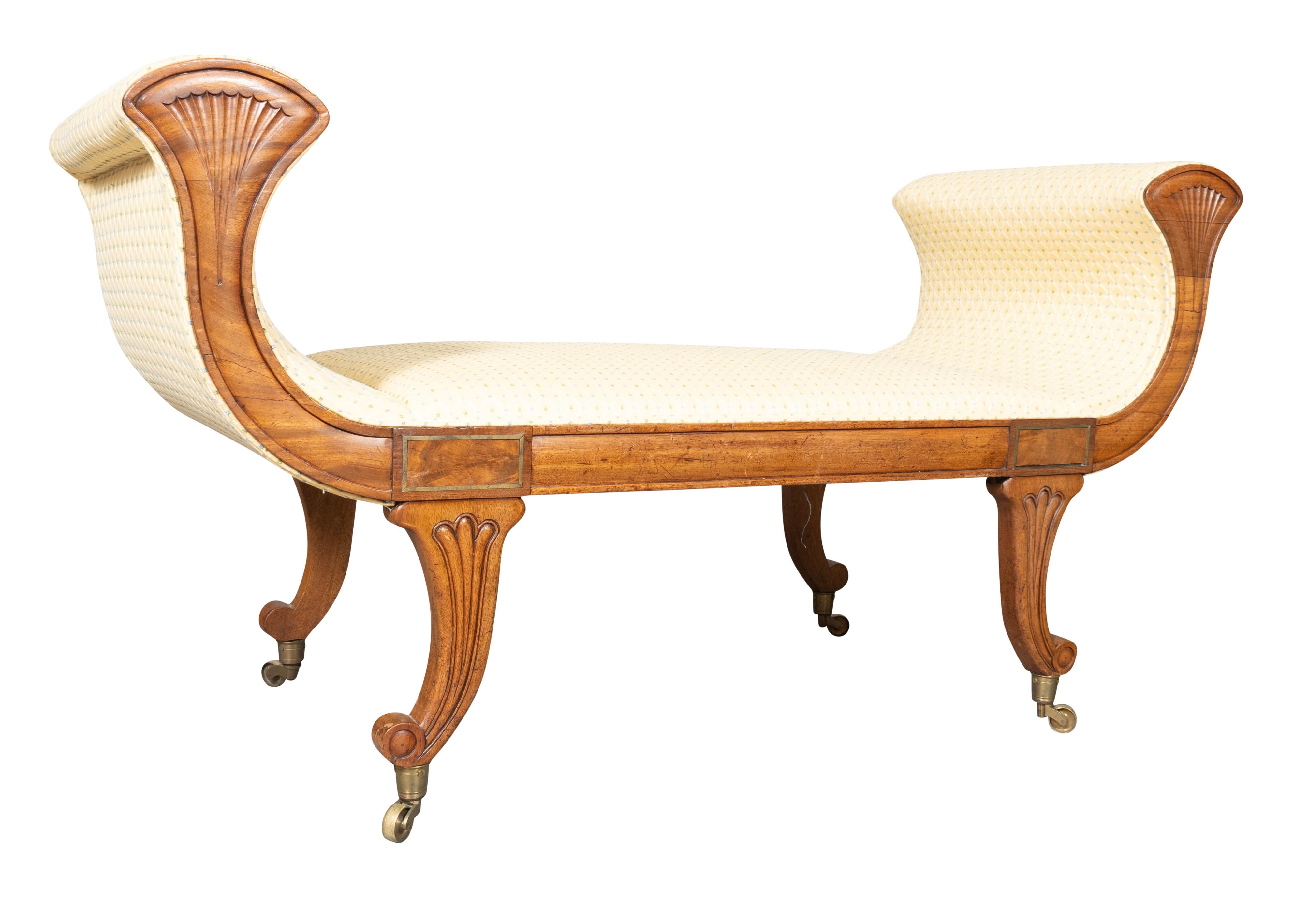 Classical form with raised curved arms with fan carving. Rectangular seat and molded seat rail and saber legs with reeded carving. Ending on casters.