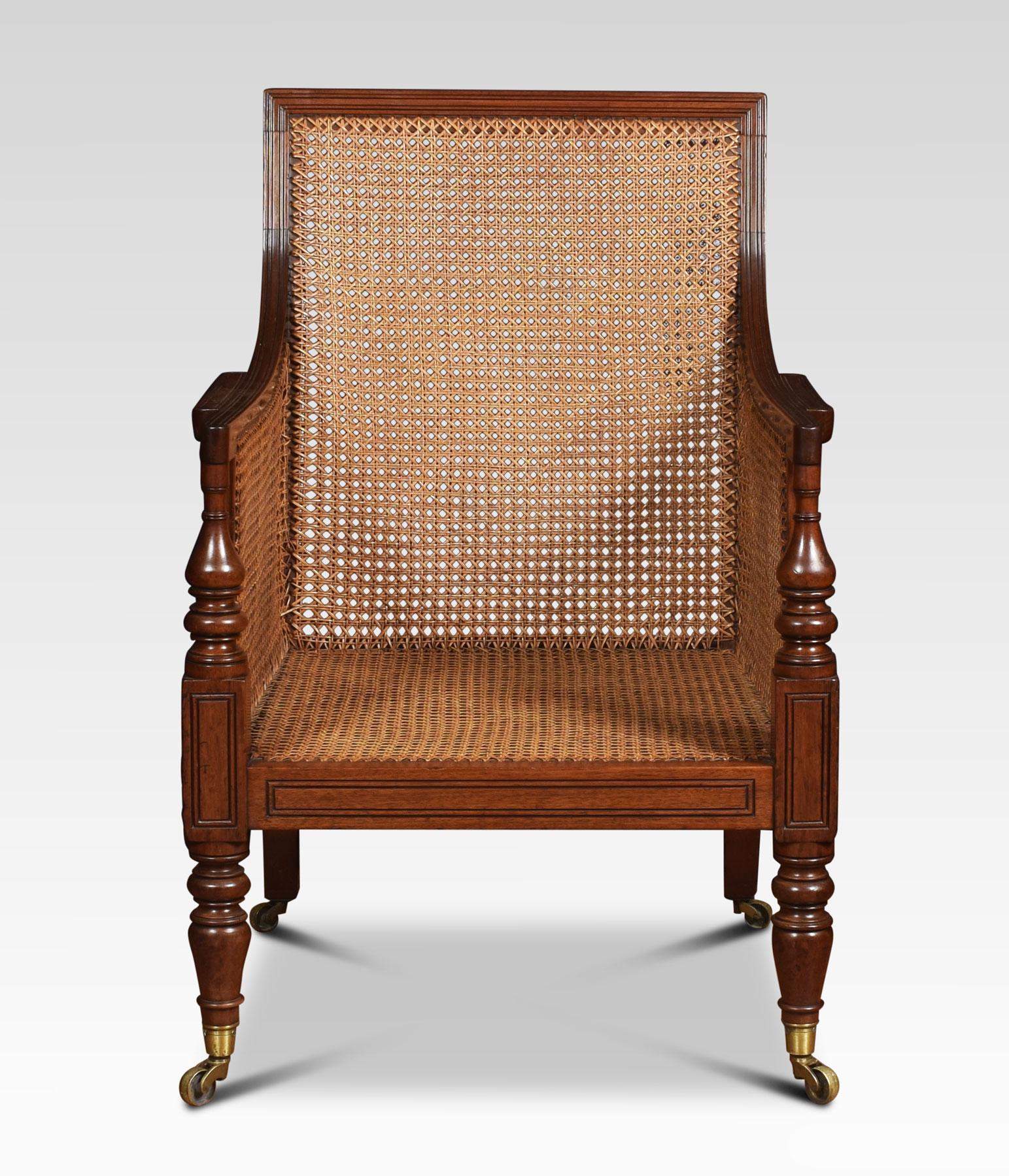 19th century bergere armchair, the solid mahogany frame and inset cane back and arms, above removable burgundy leather cushions. Raised up on turned tapering front legs terminating is castors.
Dimensions:
Height 38 inches height to seat 16.5