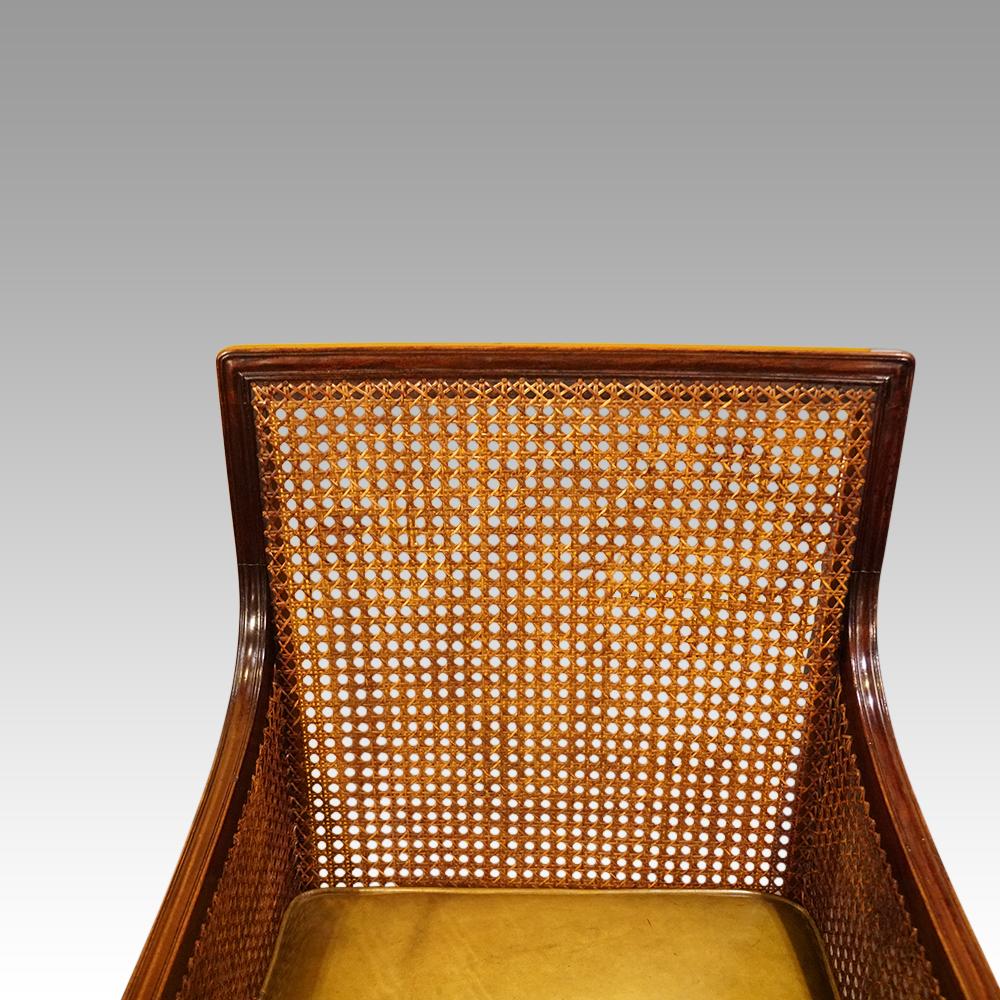 Regency mahogany bergere library chair 
This Regency mahogany bergere library chair was made circa 1820.
A classic shape and design with the turned arm supports and finely turned front legs.
Having the bergère cane to the back and sides.
It has a