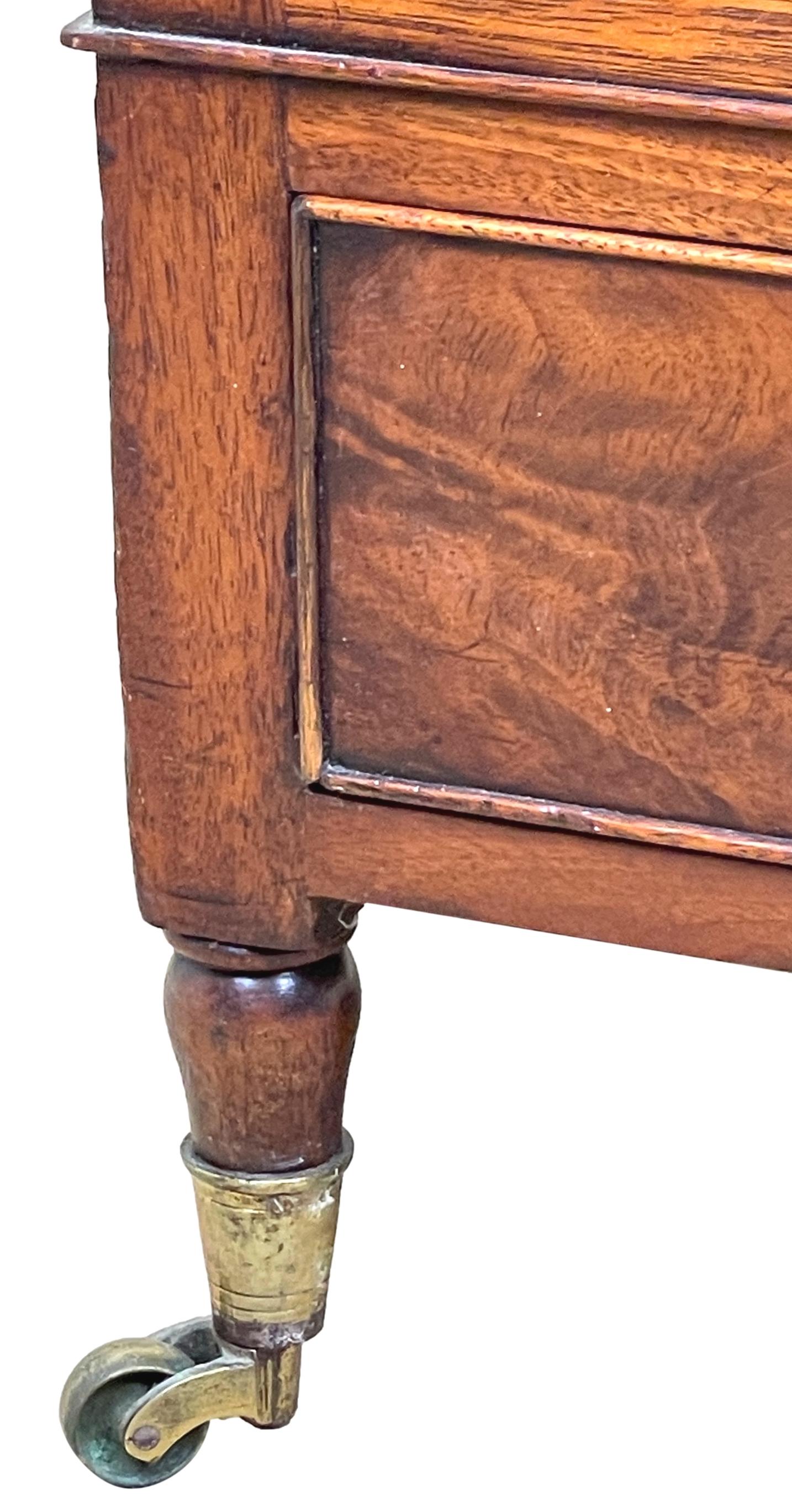 A Good Quality Regency Mahogany Boat Shaped Canterbury Having Elegant Turned Upright Supports And One Well Figured Frieze Drawer Raised On Elegant Turned Legs.

The term Canterbury is believed to have originally been used to describe articles such