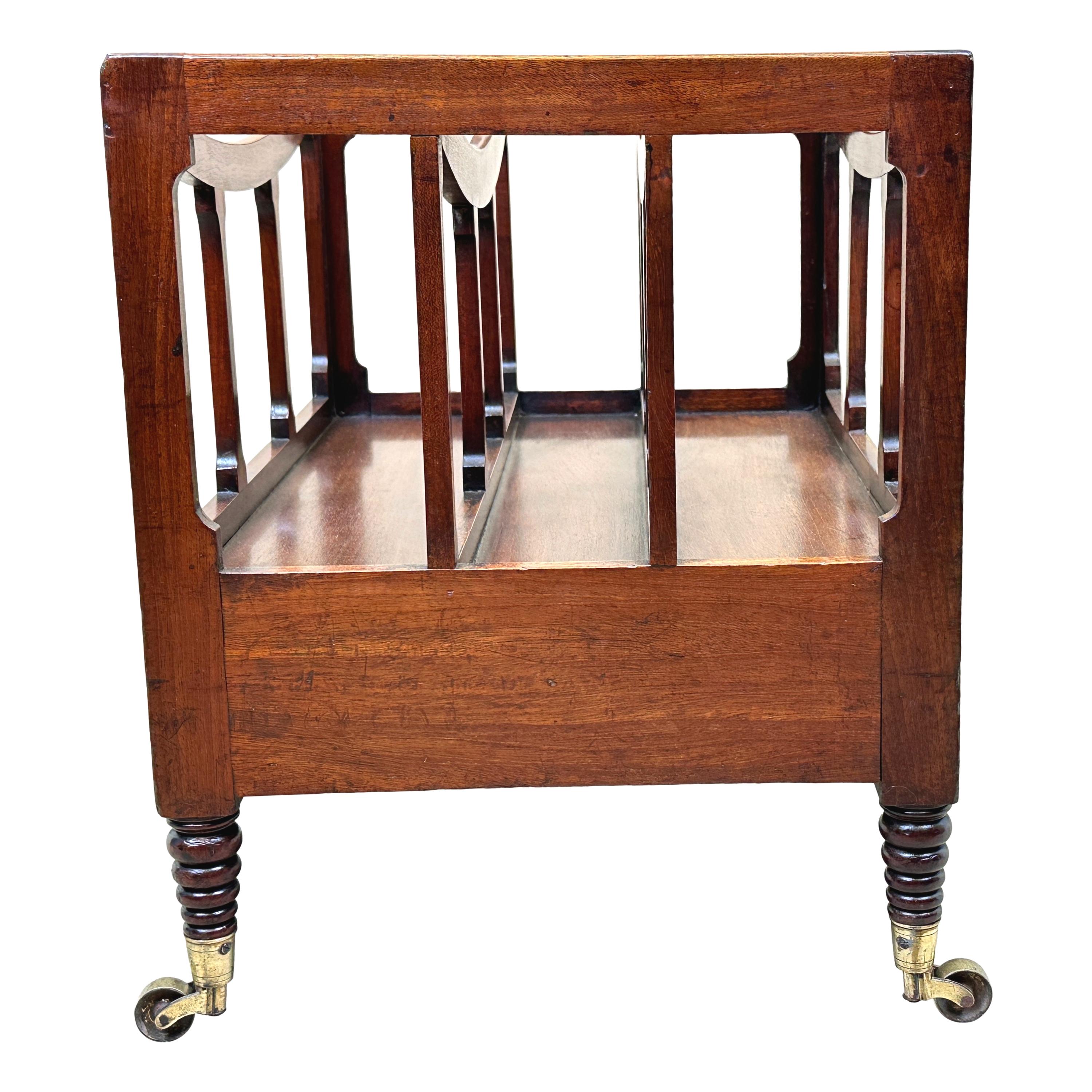 A very good quality early 19th century, regency period, mahogany boat shaped canterbury, having elegant square upright supports and divisions, over one frieze drawer, raised on unusual beehive turned legs with original brass castors.


The term