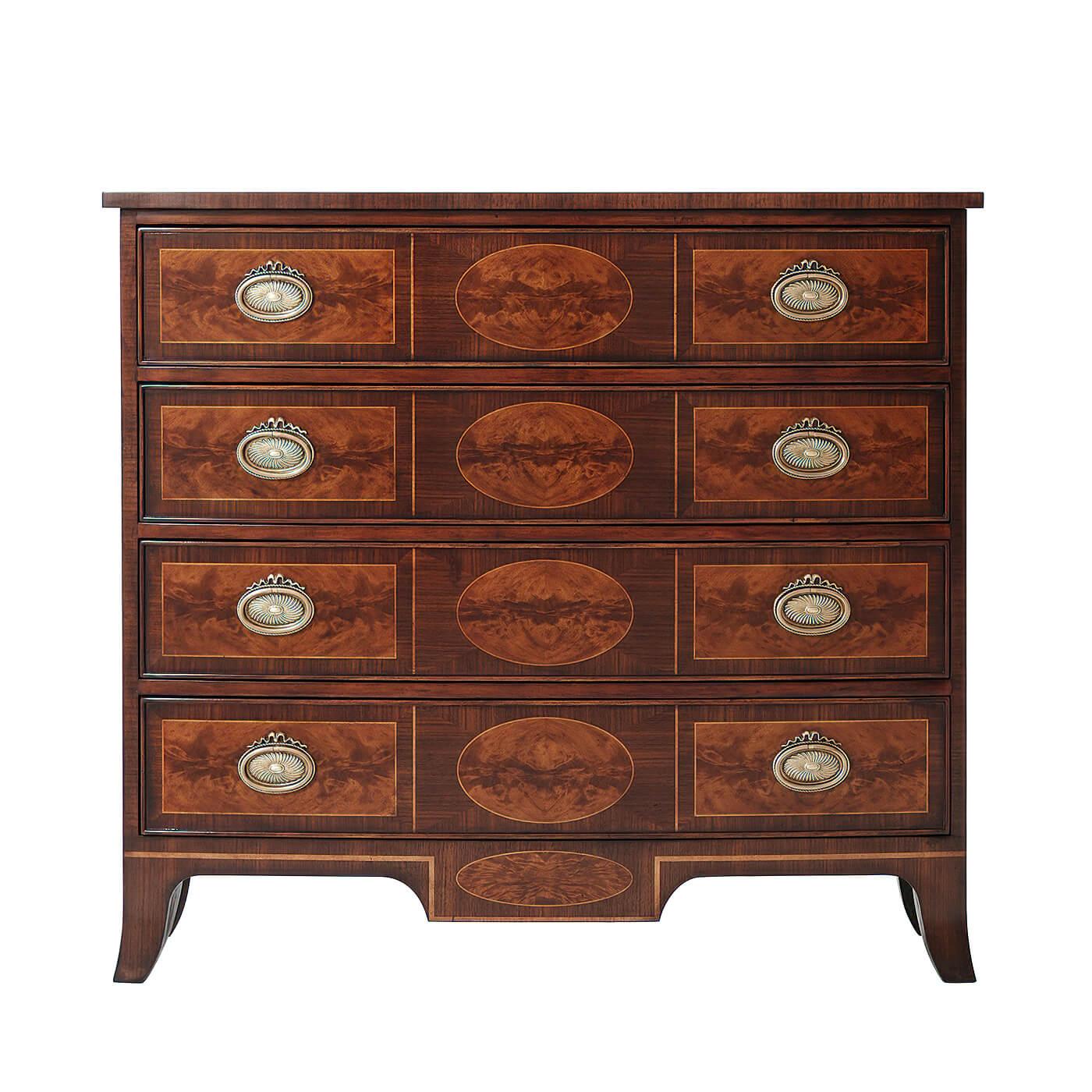 An English Regency style mahogany, flame veneered and walnut banded chest of drawers, the bowfront top above four oval panel inlaid drawers on splay feet.

Dimensions: 40