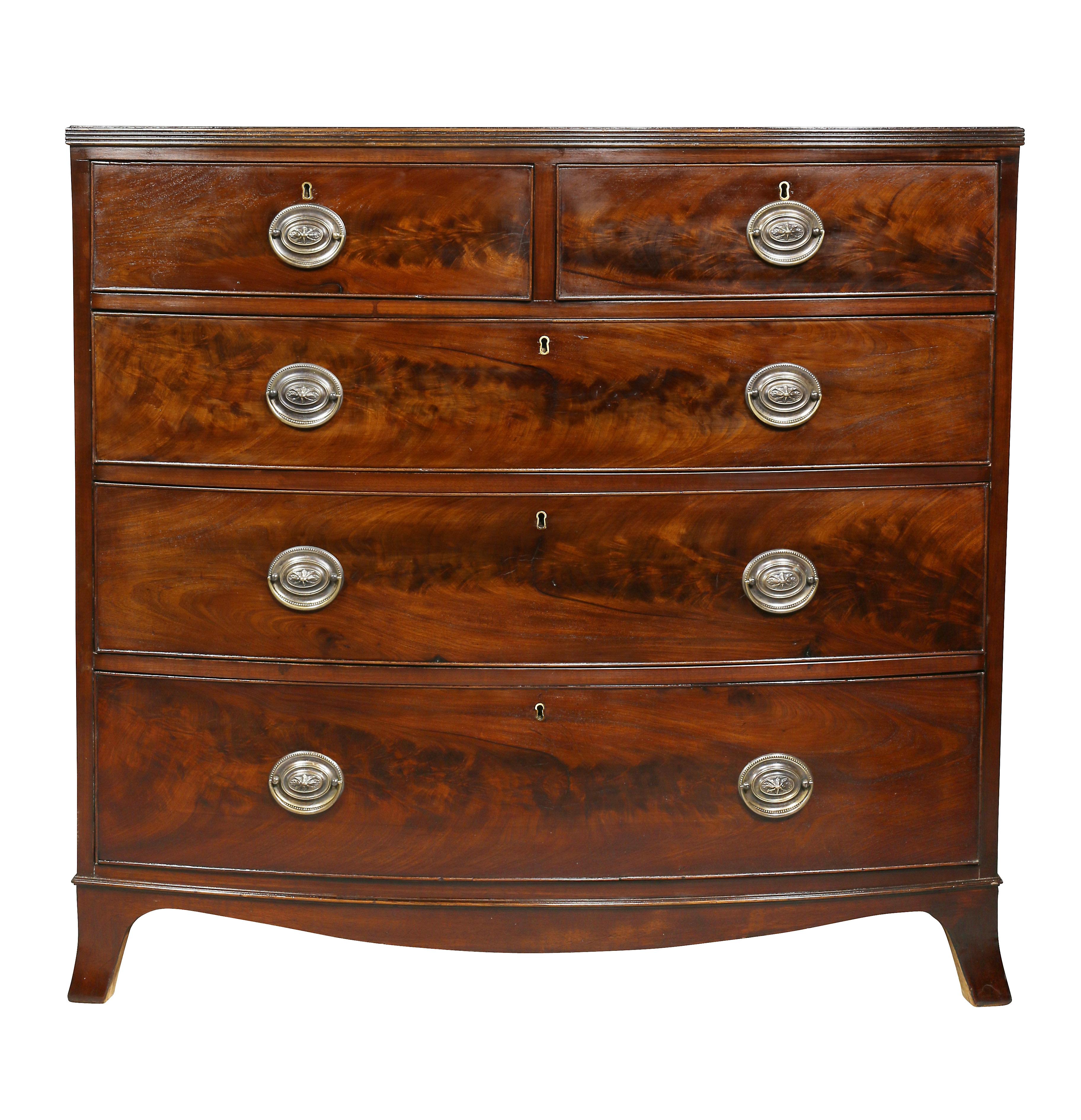 Bowed top over two over three drawers, splayed bracket feet. Oval brass handles.