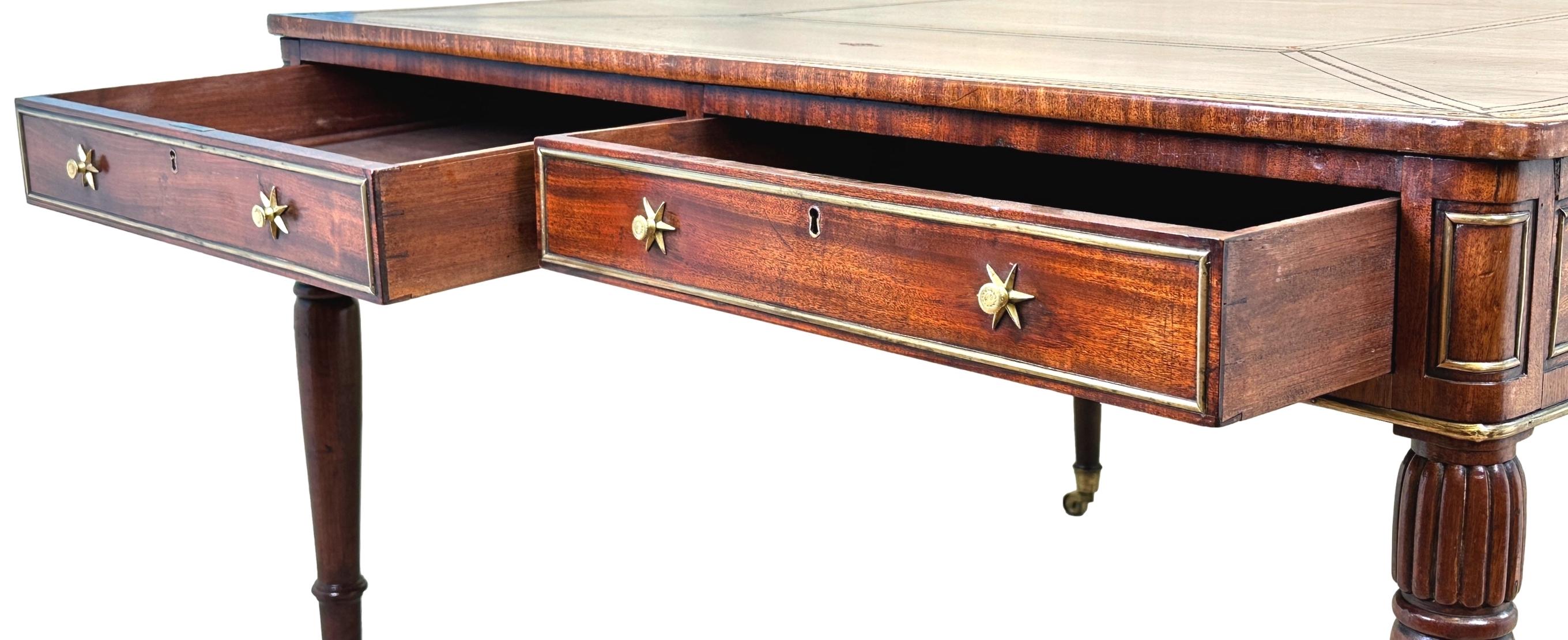 An Exceptional Quality Regency Period Mahogany And Brass, Square, Partners Writing Table, Having Attractive Gilt Tooled Leather Top With Crossbanded Edge, Over Four Drawers And Four False Drawers To Frieze, With Original Brass Moulded Decoration And