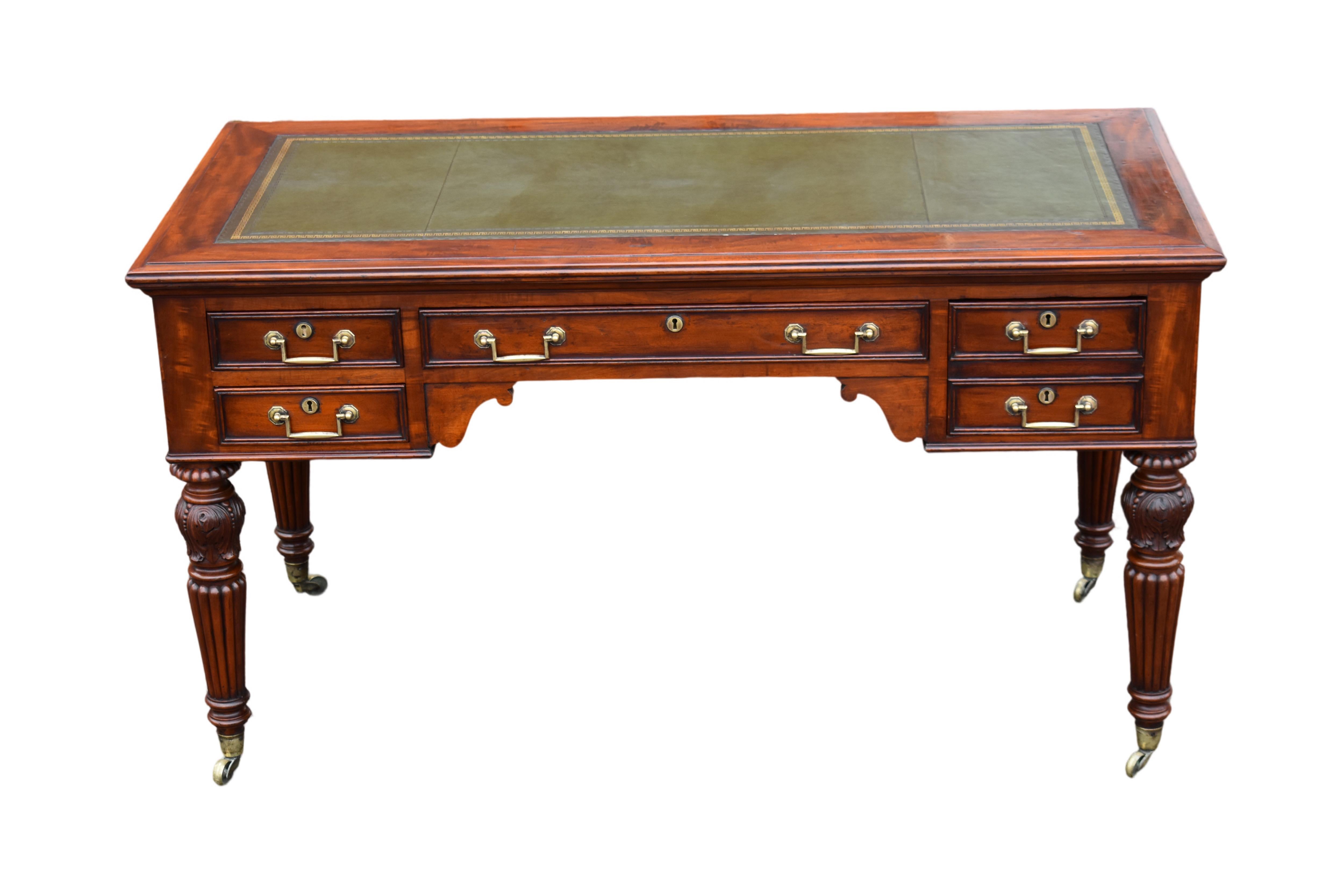 A good early 19th century mahogany campaign library- writing table.
The front facing side with twin shallow drawers to the left hand side, wide drawer in the centre and double fronted deep drawer on the right.
Dummy drawers to the rear.
The green
