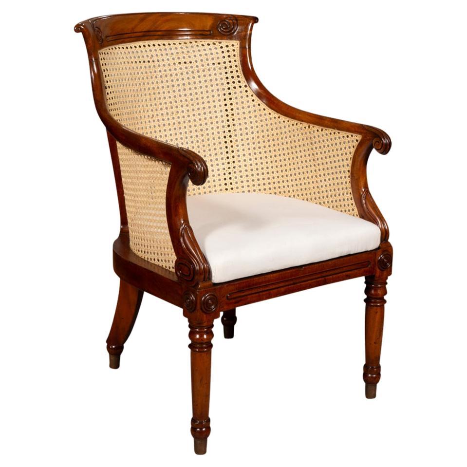 Pair Of Mahogany Regency Influenced Bergere Cane Chairs at 1stDibs