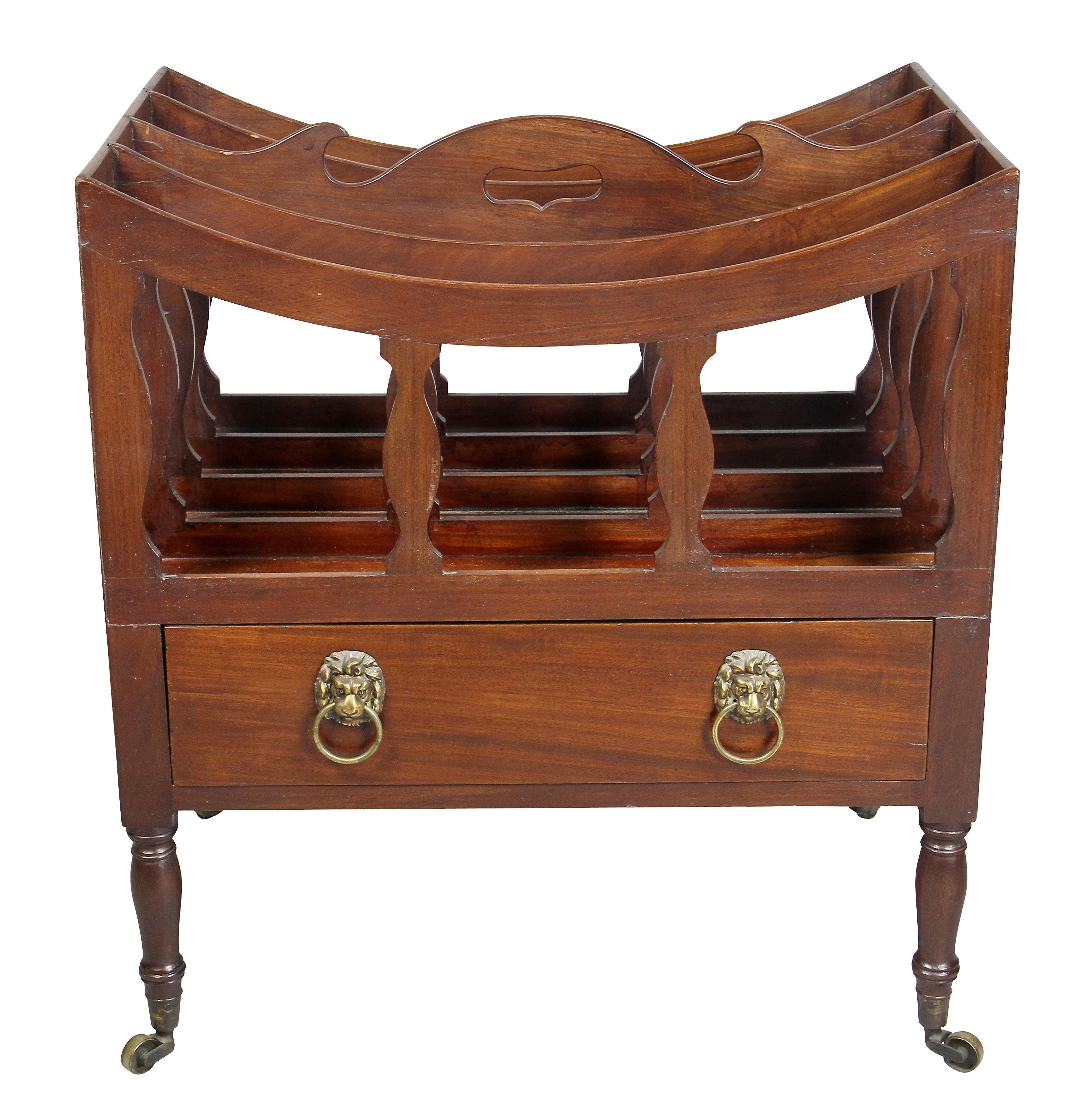 Typical form with single drawer with lions head handles, circular legs, casters.