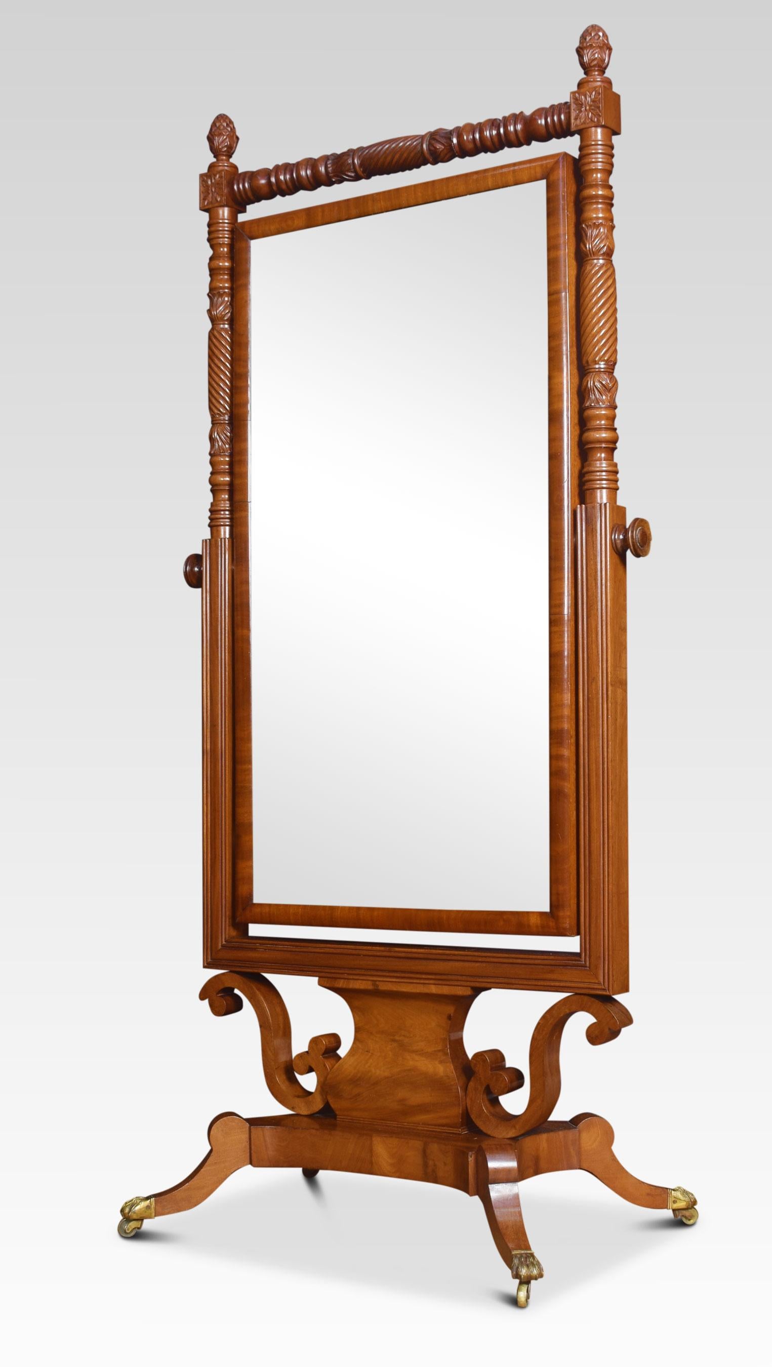 Regency mahogany cheval. The original mirror plate within a cross-banded frame, between ring turned and spiral column supports on a raised platform base with splayed legs and lion’s paw castors.
Dimensions:
Height 69 inches
Width 32 inches
Depth