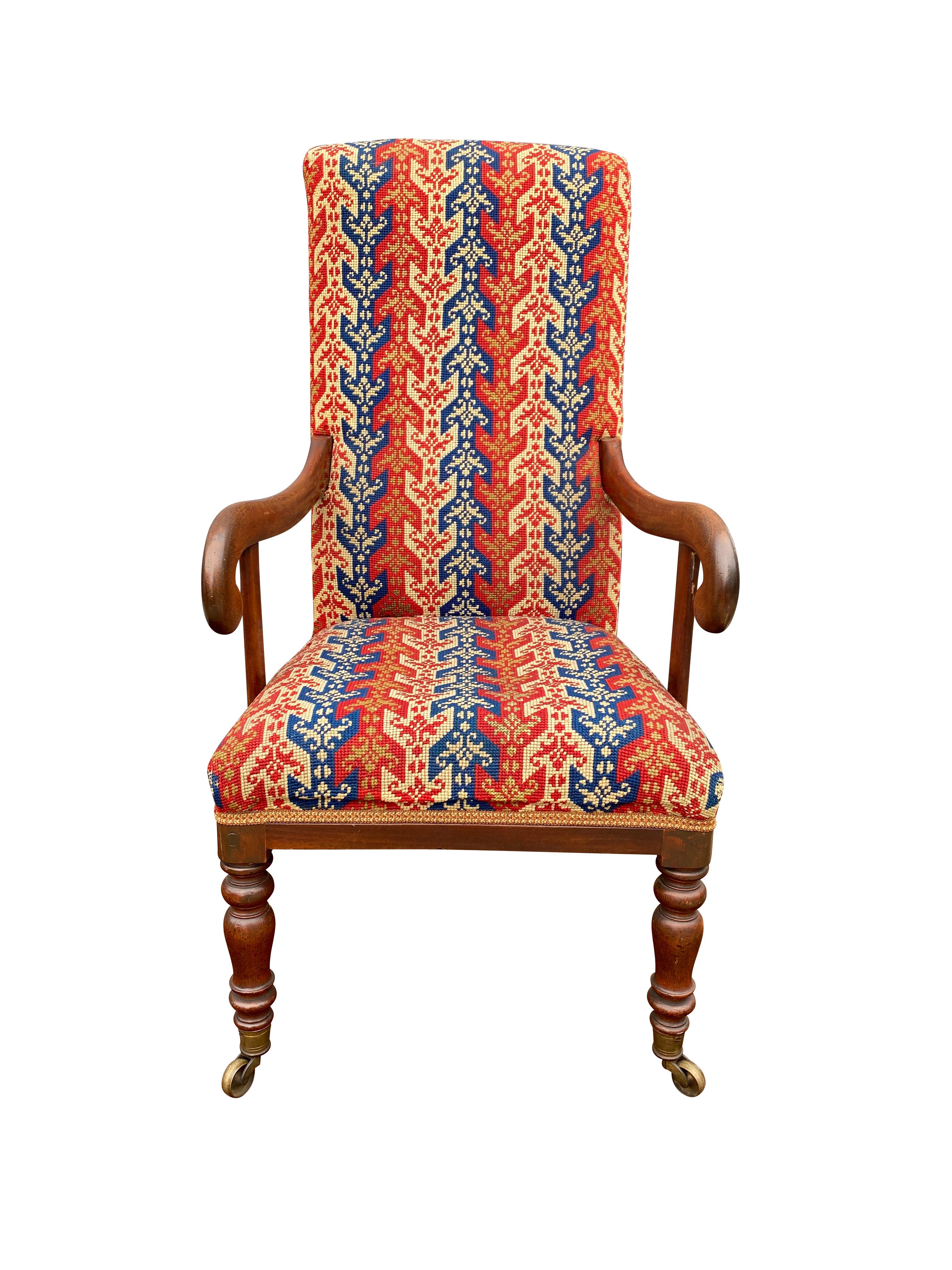 Rectangular upholstered back and seat, scrolled arms and raised on turned legs and casters.
