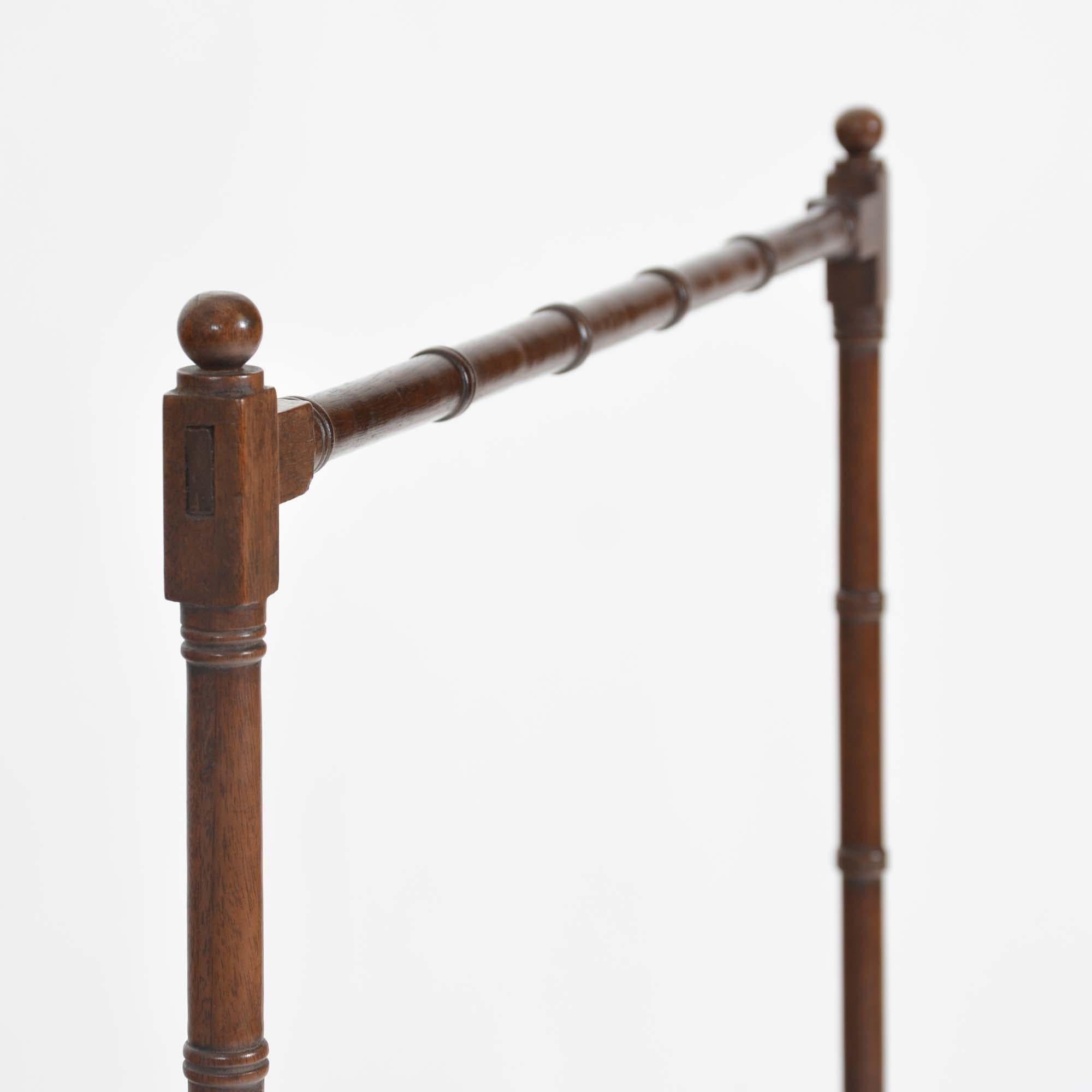 Regency mahogany towel rail with bamboo turned mahogany trestle-ends united by the two rails.   For towels or otherwise know and a clothes horse, an example of a Regency period rail in the fashionable faux bamboo style which is now very much back in