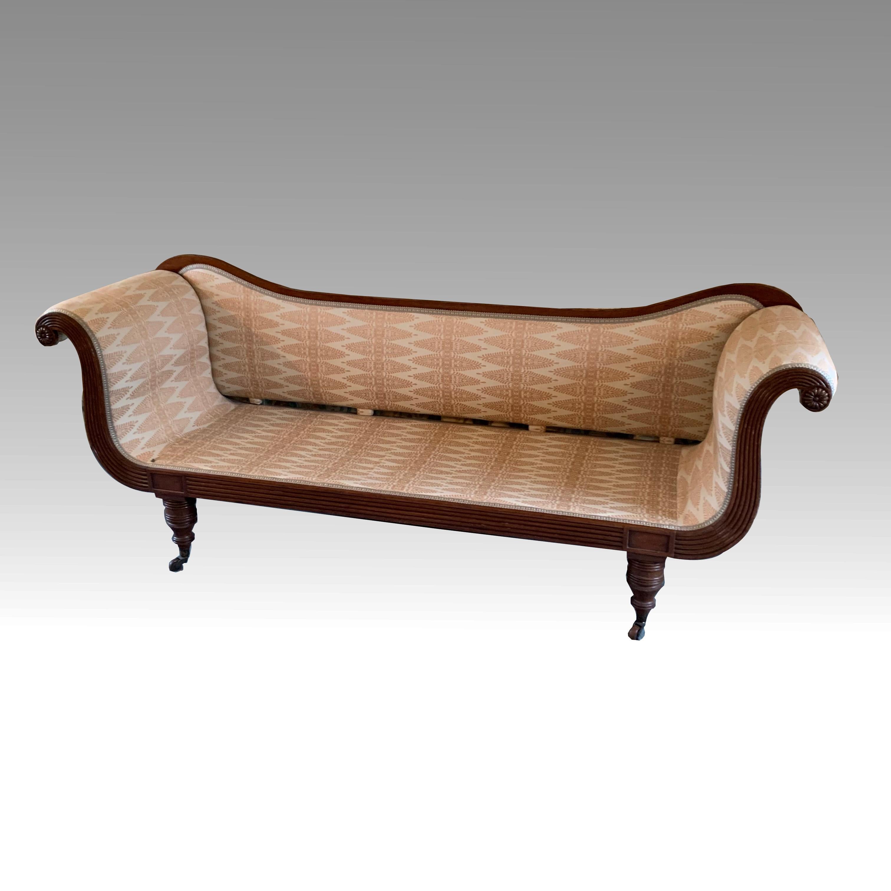 fine quality Regency scroll end settee with carved and reeded frame. A stylish and comfortable sofa in good origional condition. 
Upholstery is beige on white and although not new, is is clean and usable, or could be recovered in a fabric of your