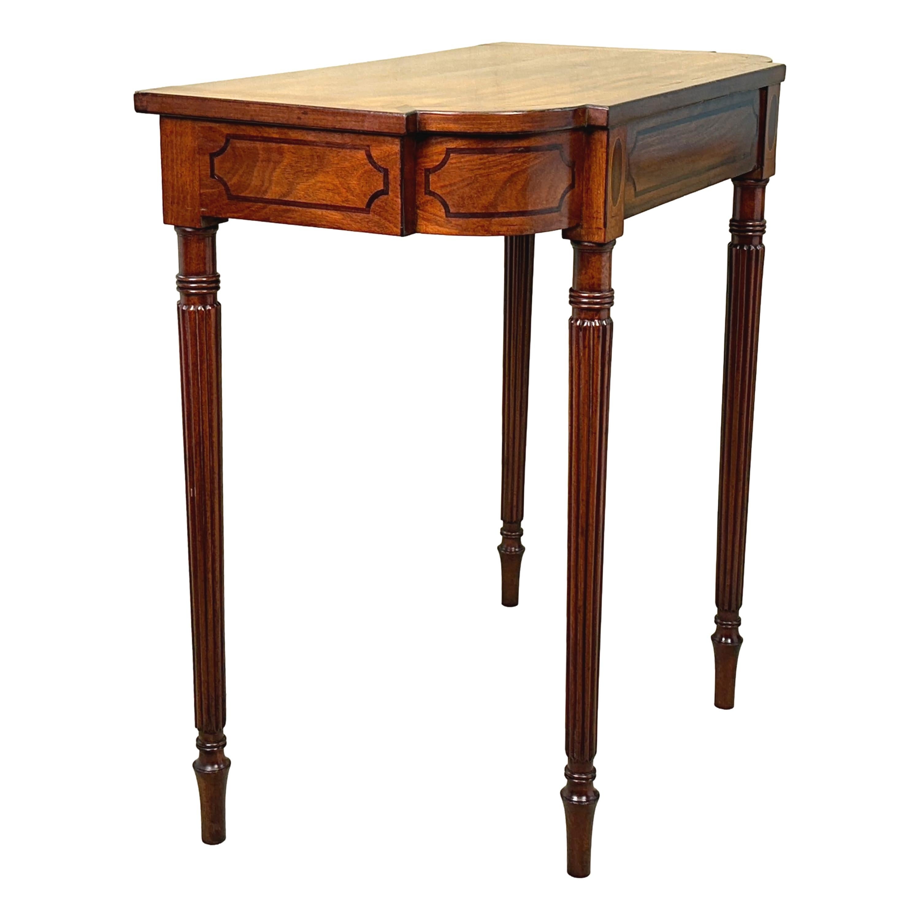 An Extremely Fine Early 19th Century, Regency Period, Mahogany Hall Console Table, Or Pier Table, Of Breakfronted Form And Rare Diminutive Proportions, Having Superbly Figured Top With Crossbanded Decoration Over Attractive Inlaid Frieze, Raised On