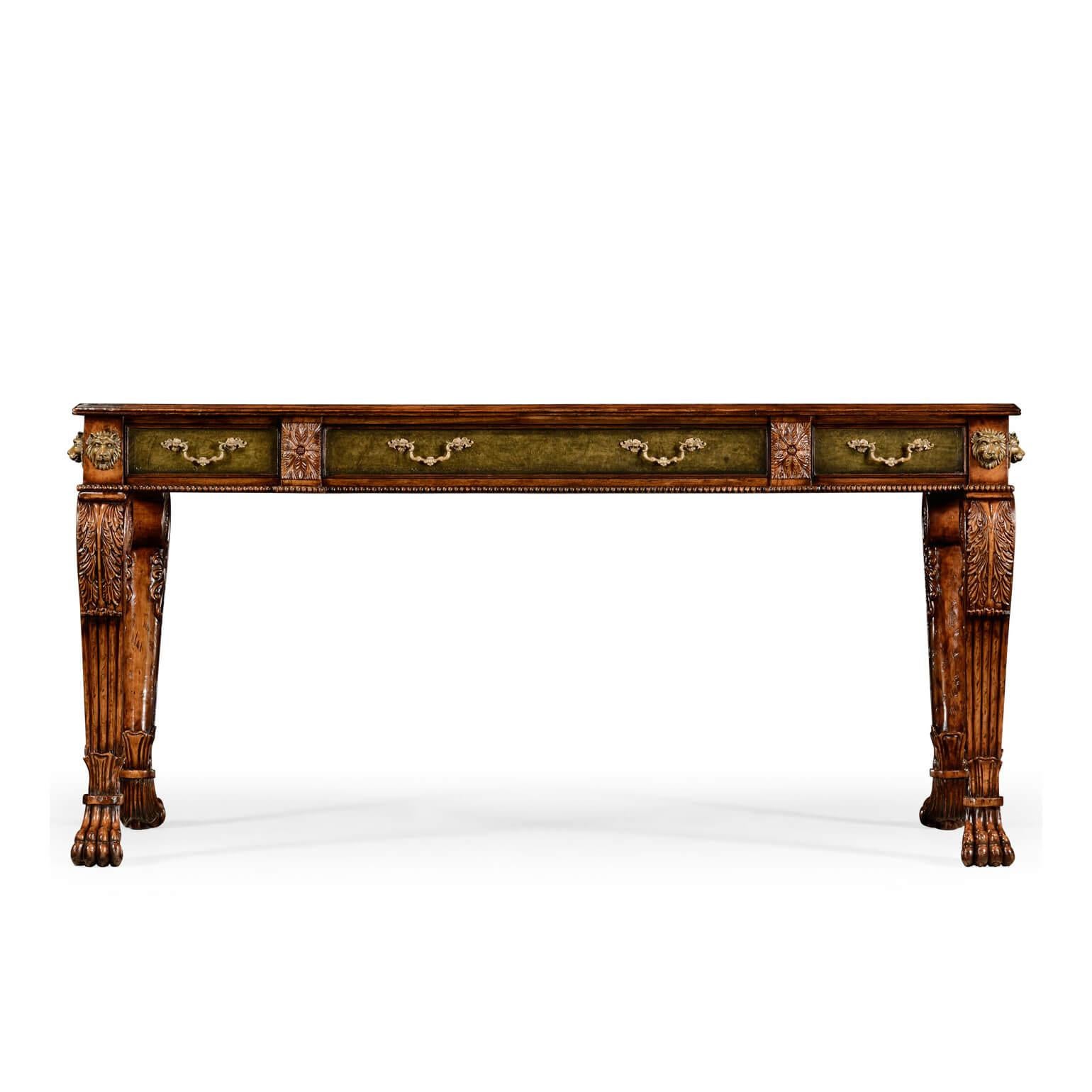 A Regency style leather top walnut carved writing table with brass lion heads, carved acanthus knees, three drawers, and Lion paw feet.

Dimensions: 64