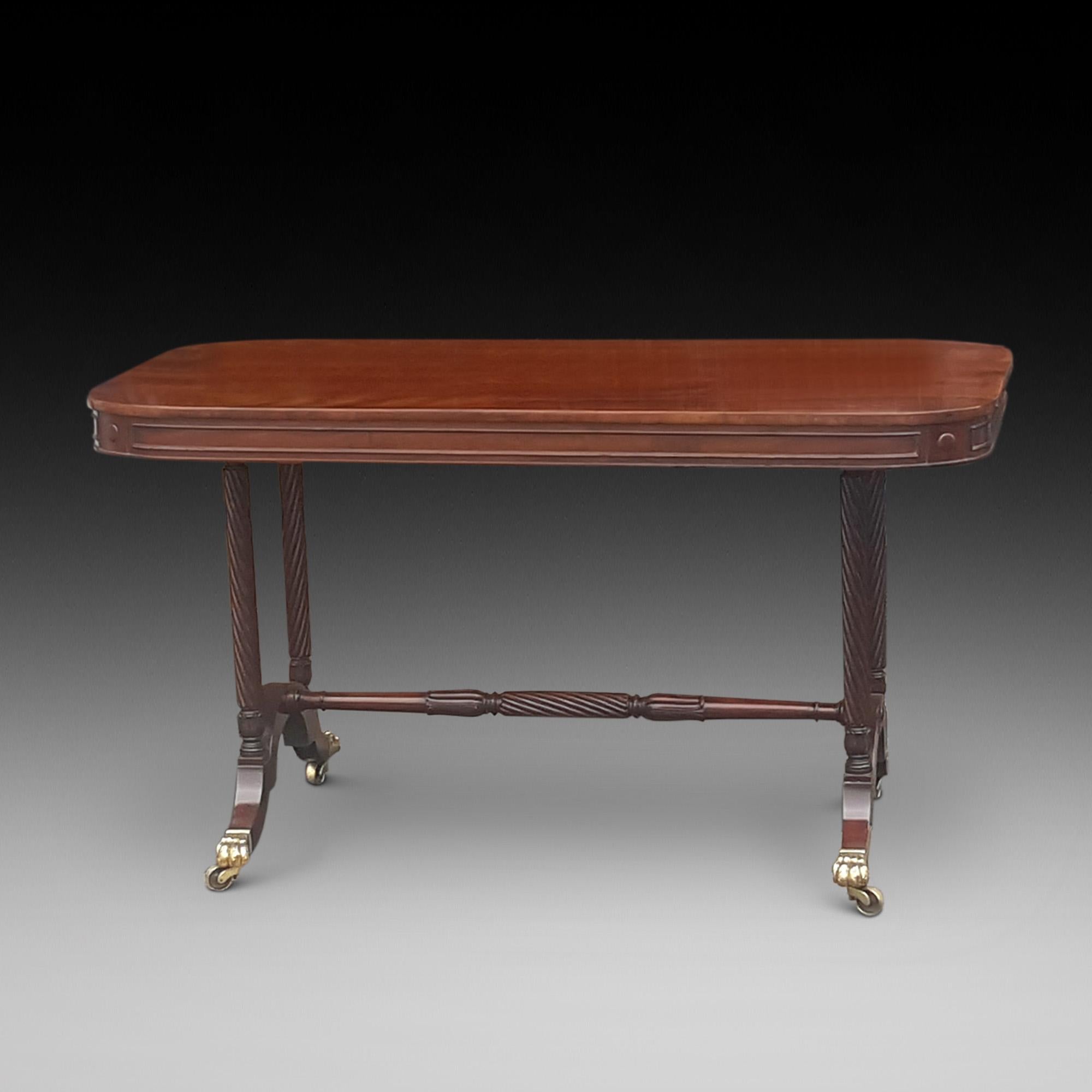 Regency mahogany library table by Gillows with rope twist and acanthus leaf carved end supports and stretcher with sabre legs leading to brass lion paw castors, Stamped 