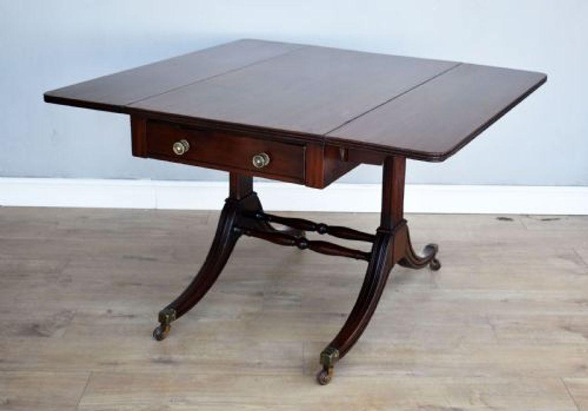 For sale is a good quality Regency mahogany pembroke table, having two drop leaves, raised on elegant legs united by two turned stretchers, terminating on splayed feet with brass castors. Overall, the table is in very good condition for its