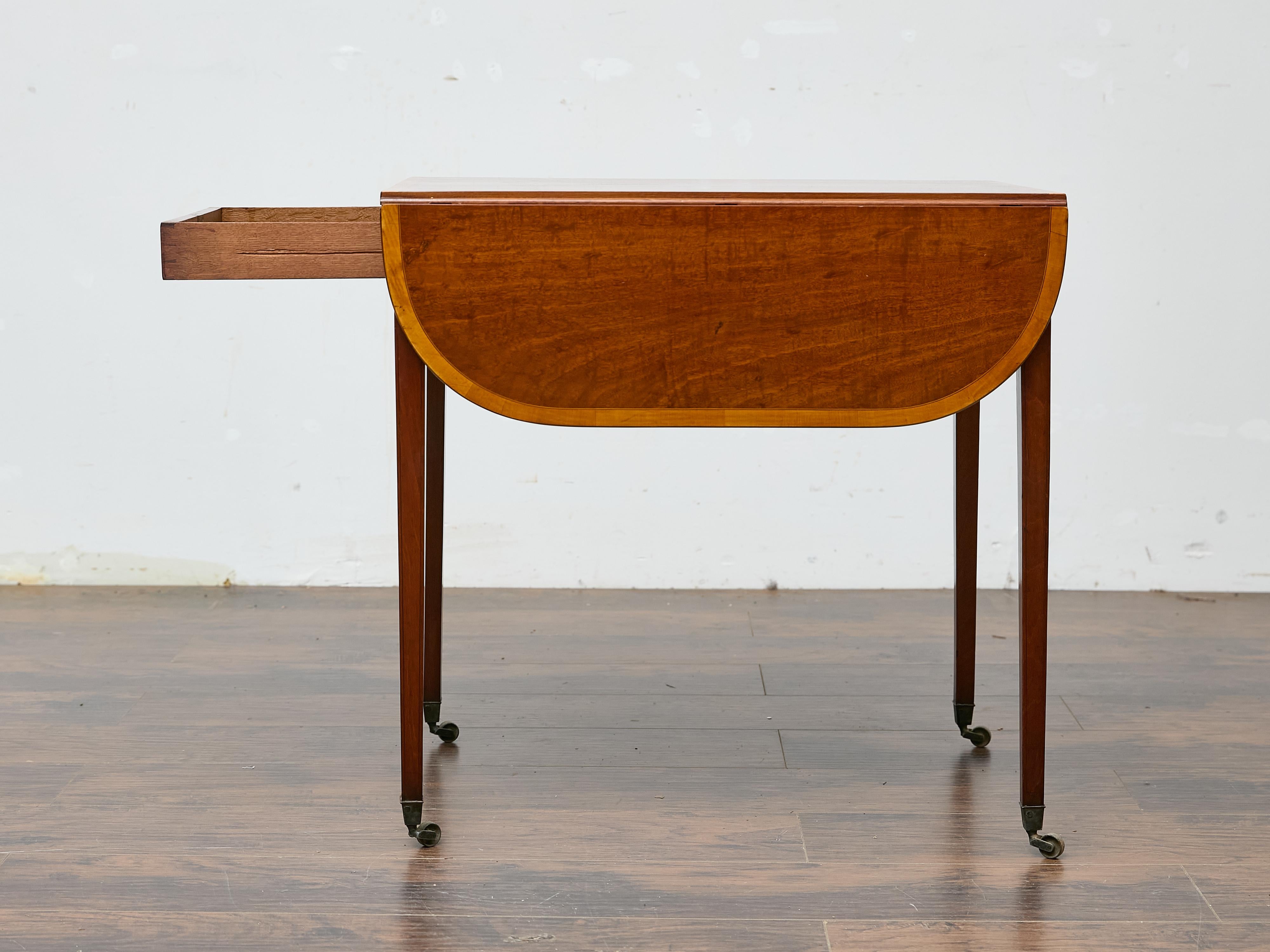 English Regency Mahogany Pembroke Table with Satinwood Inlay and Casters For Sale