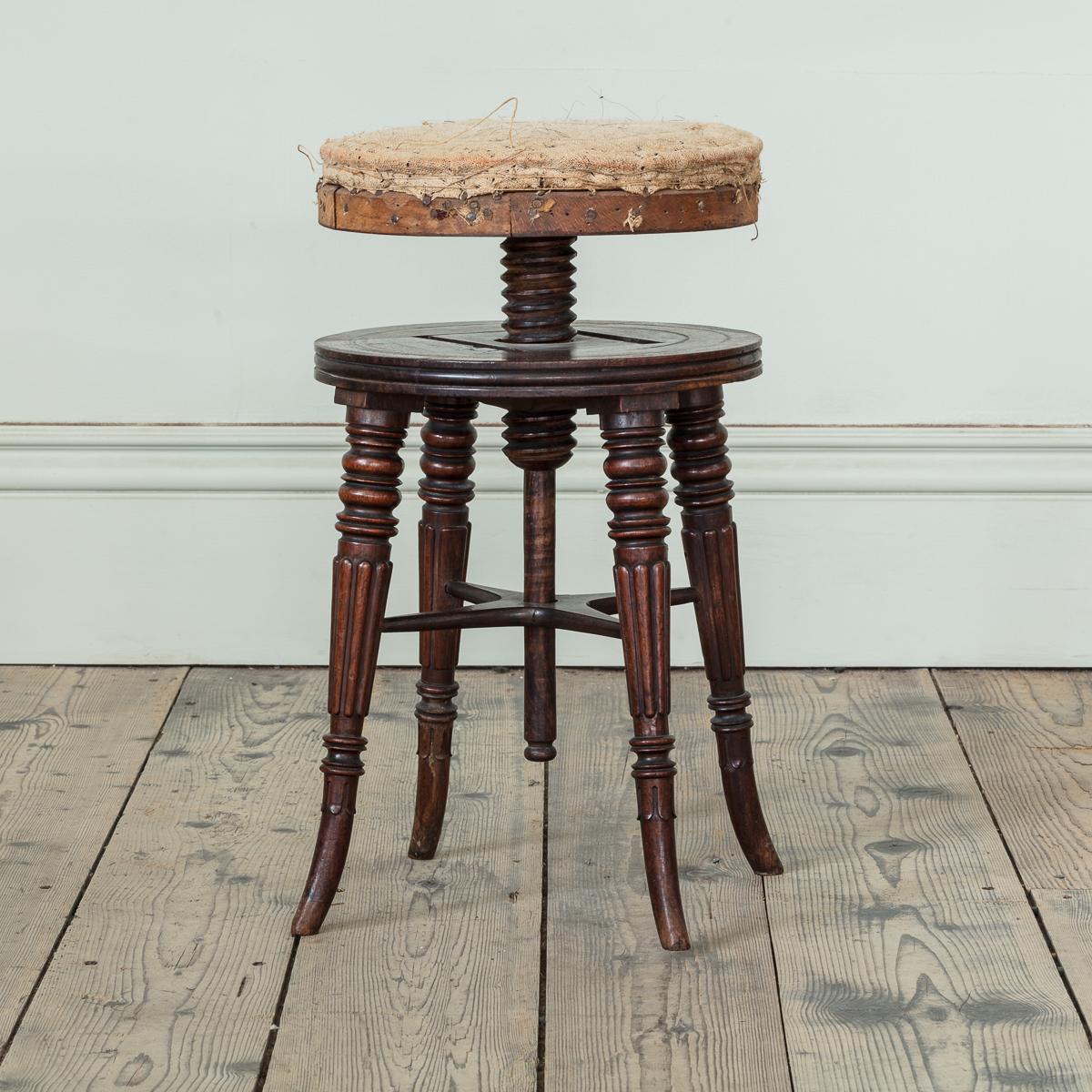 A Regency Mahogany Piano Stool in the Manner of Gillows, c.1815 with turned and fluted tapering legs, and extendable seat height action and original wooden thread.

Additional information:
Dimension: Seat Diameter: 33 cm, 13″
Height (lowest): 40 cm,
