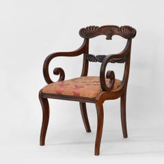Regency mahogany sabre leg armchair