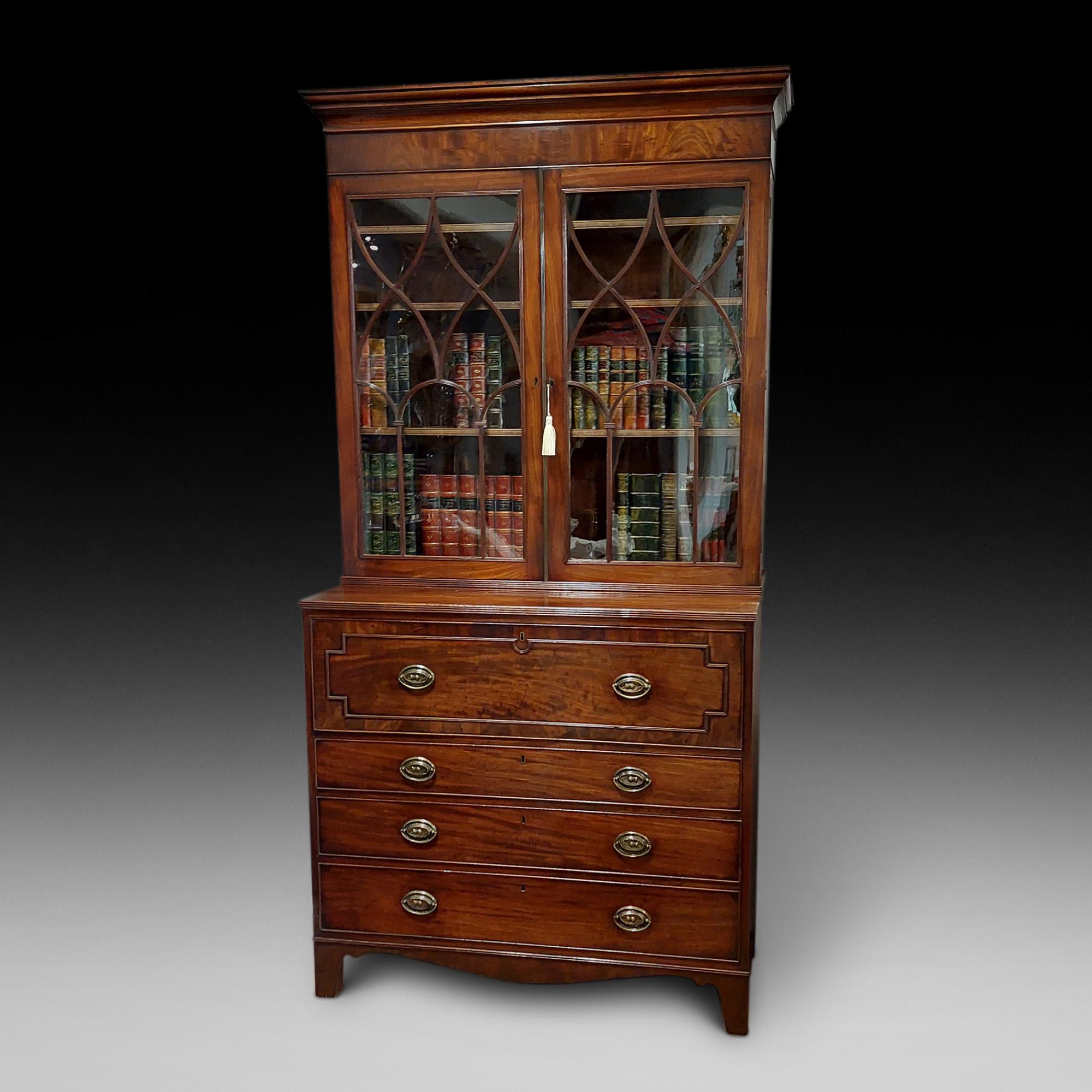George IV mahogany secretaire bookcase, the upper section with a pair of eliptical glazed doors, the base with satinwood lined serectair drawer above a further three long drawers on shaped bracket feet - 43