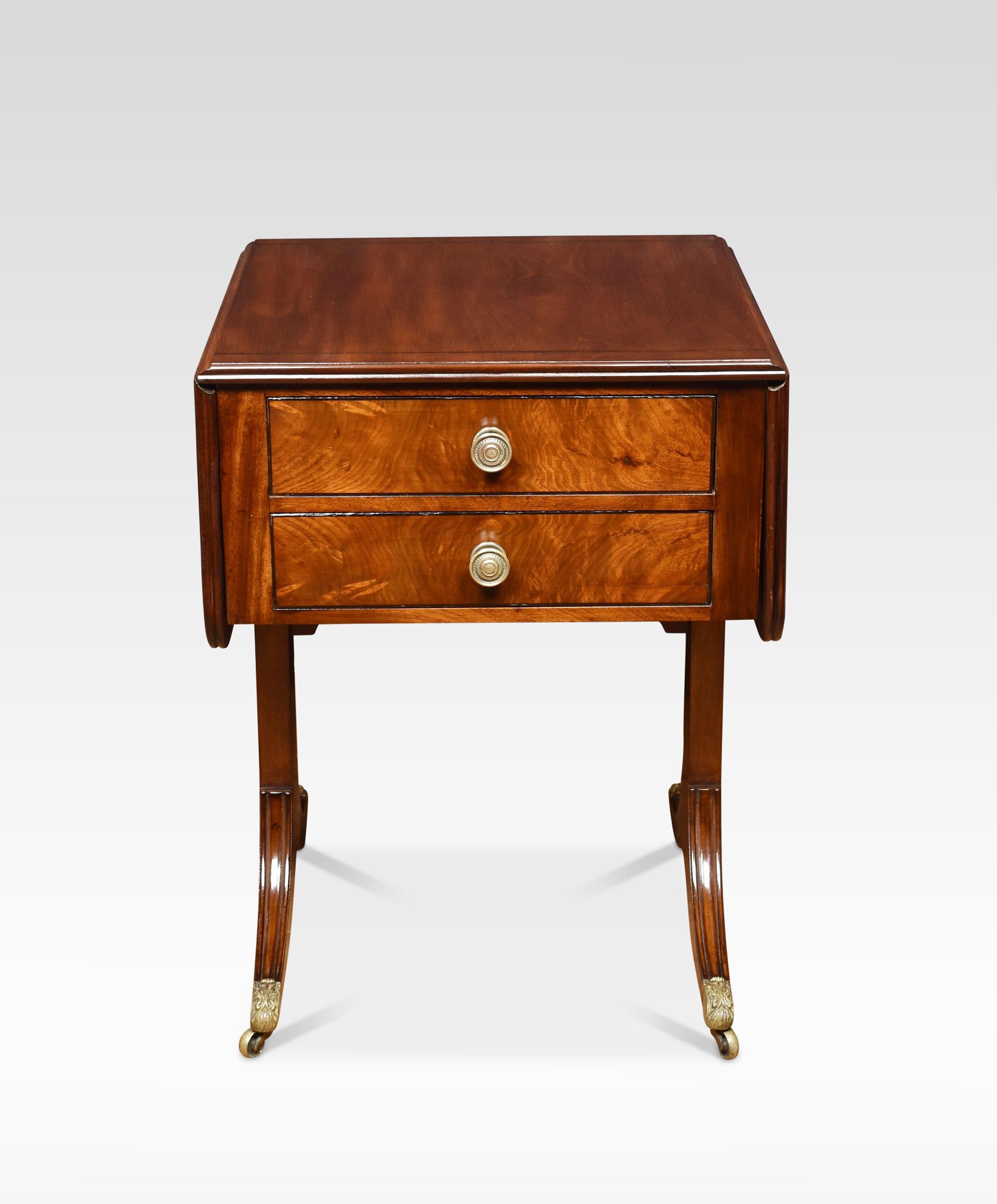 Regency mahogany lamp table of small proportions, the rounded rectangular string inlaid top above two frieze drawers with brass handles. All raised up on saber legs with brass caps and castors.
Dimensions
Height 29 inches
Width 21.5 inches when