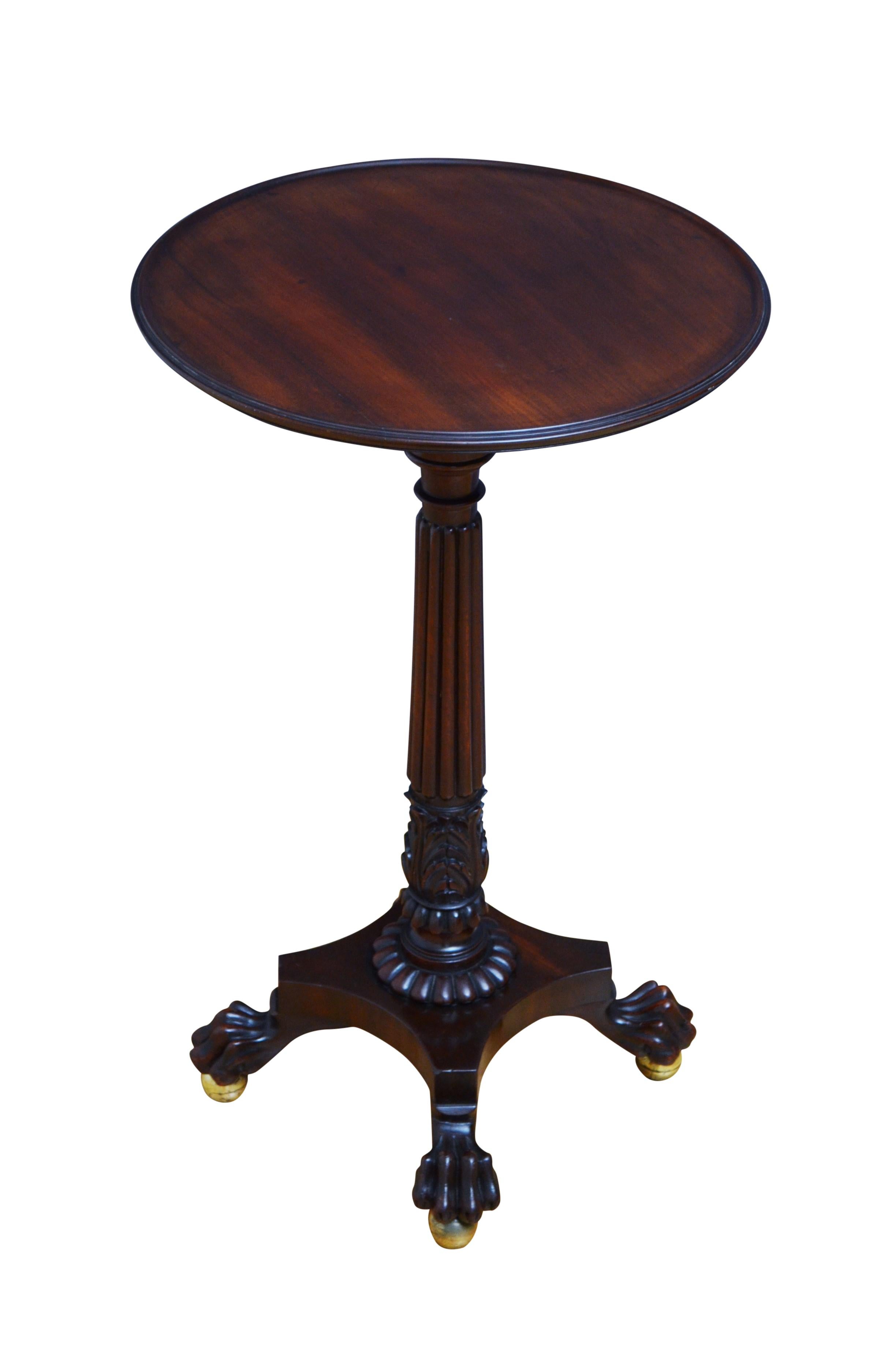 P0201 Superb Regency side or lamp table, having dished top in figured mahogany, standing on slender, fluted column with acanthus carved capital and petal carved collar terminating in quatrefoil base, paw feet and brass ball feet. This antique