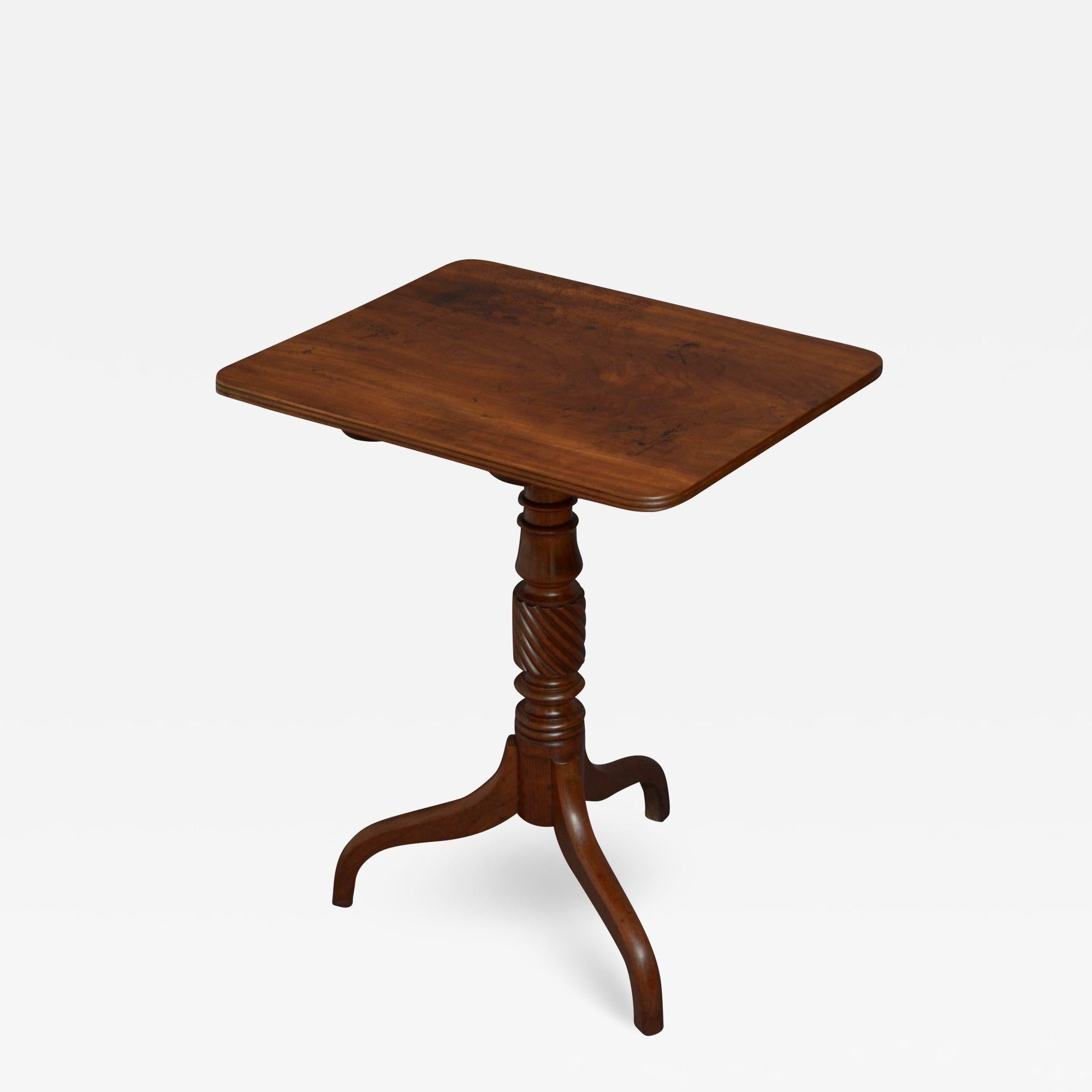 Sn4937, elegant regency mahogany occasional table, having solid, figured mahogany top with reeded edge on shaped, turned, reeded and twisted column terminating in three downswept legs. This antique table retains its original finish, colour and