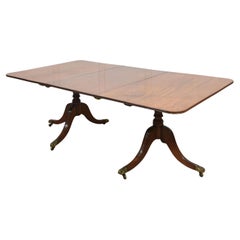 Regency mahogany twin pillar dining table