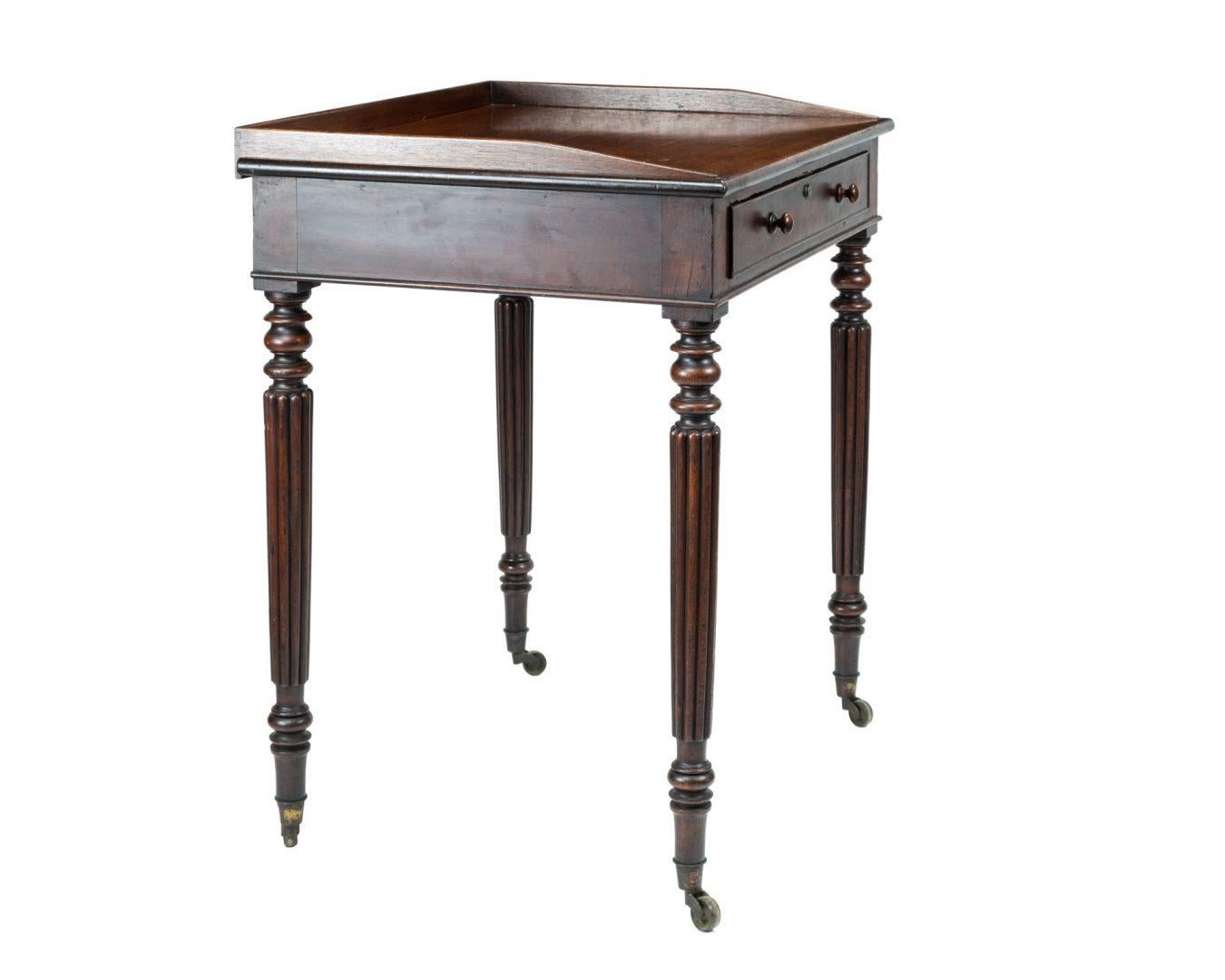 A Regency mahogany writing table attributed to Gillows, early 19th century, the rectangular back with raised border on three sides above a cock beaded frieze drawer with divisions and a lock stamped Bramah, 124 Piccadilly and raised on ring turned