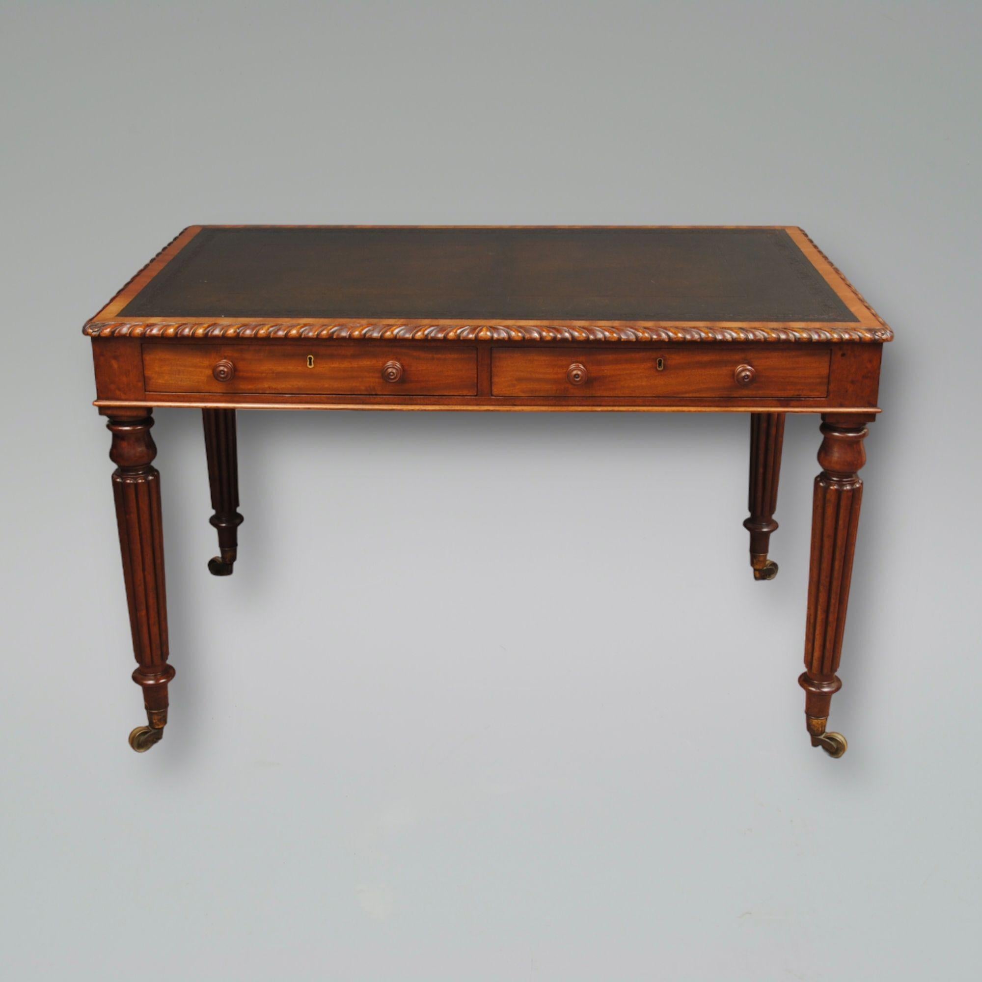 A good regency mahogany writing table in the manner of Gillows of Lancaster with a reeded leg and unusual gradooned top mould. Good colour and patina, the leather top look to be original certainly has a good age. Circa 1825