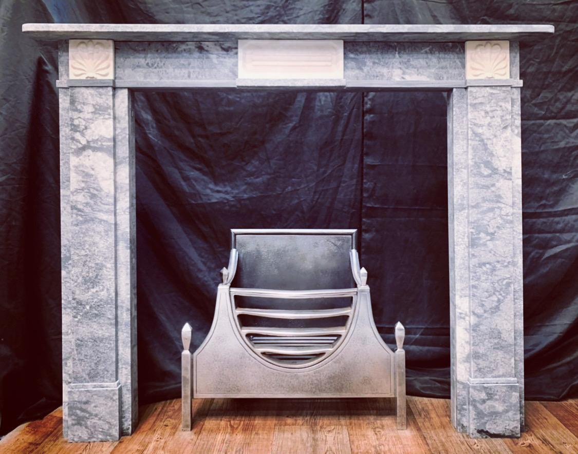 A fabulous example of a Regency manner Bardigilo & Statuary two tone marble fireplace. A square shelf with rounded corners sits above a frieze adorned with a central statuary marble raised reeded tablet set within a moulded frame, flanked by a pair