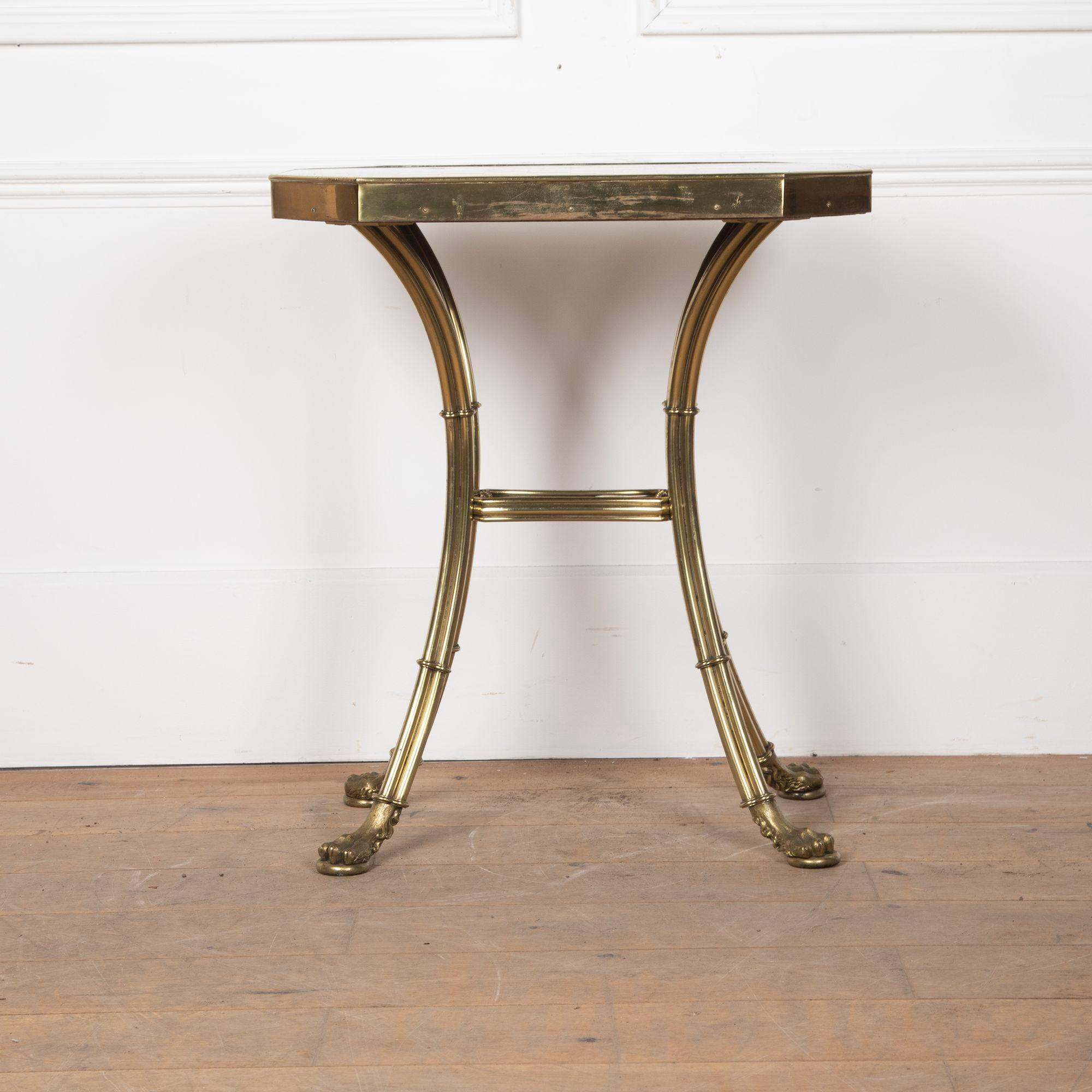 A fantastic Regency chess table.Rare Devonshire marble top with inlaid chess board of different specimen marbles. Set within a frame and base of gilt brass, consisting of four swept cluster column legs with shaped centre stretcher and terminating in