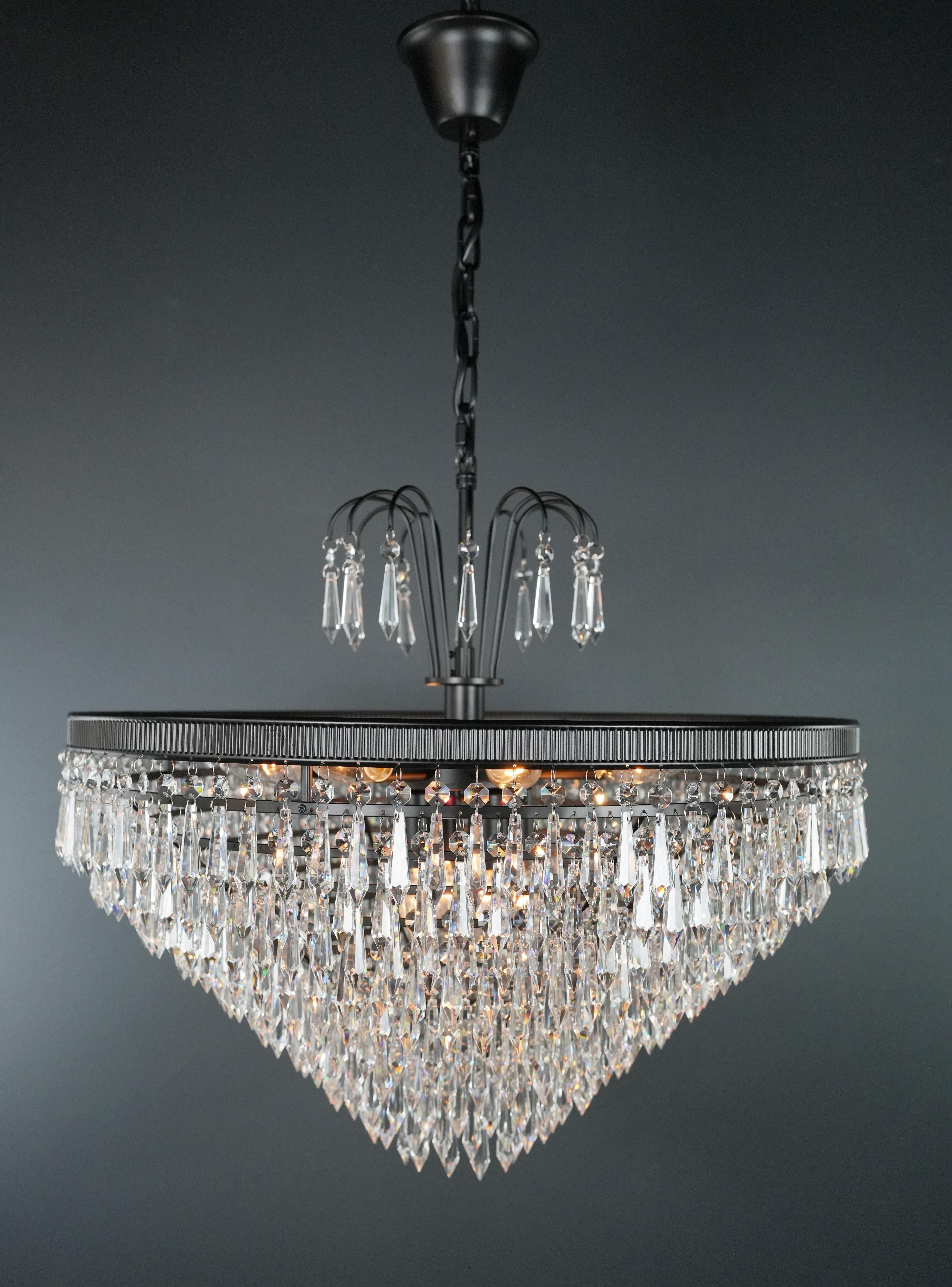 our lead crystal chandelier is a testament to opulence and craftsmanship. Crafted in-house, we offer the flexibility of both smaller and larger sizes, ensuring the perfect fit for your space. 

Key Features:
- Measures: Diameter 60 cm, Height 60